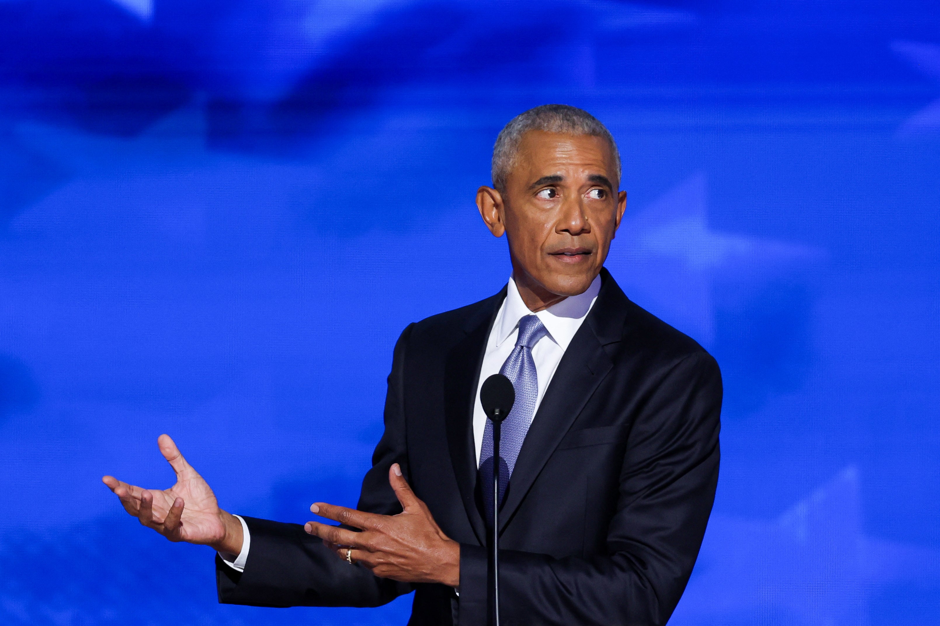 Barack Obama gestures as he speaks during Day 2 of the Democratic National Convention