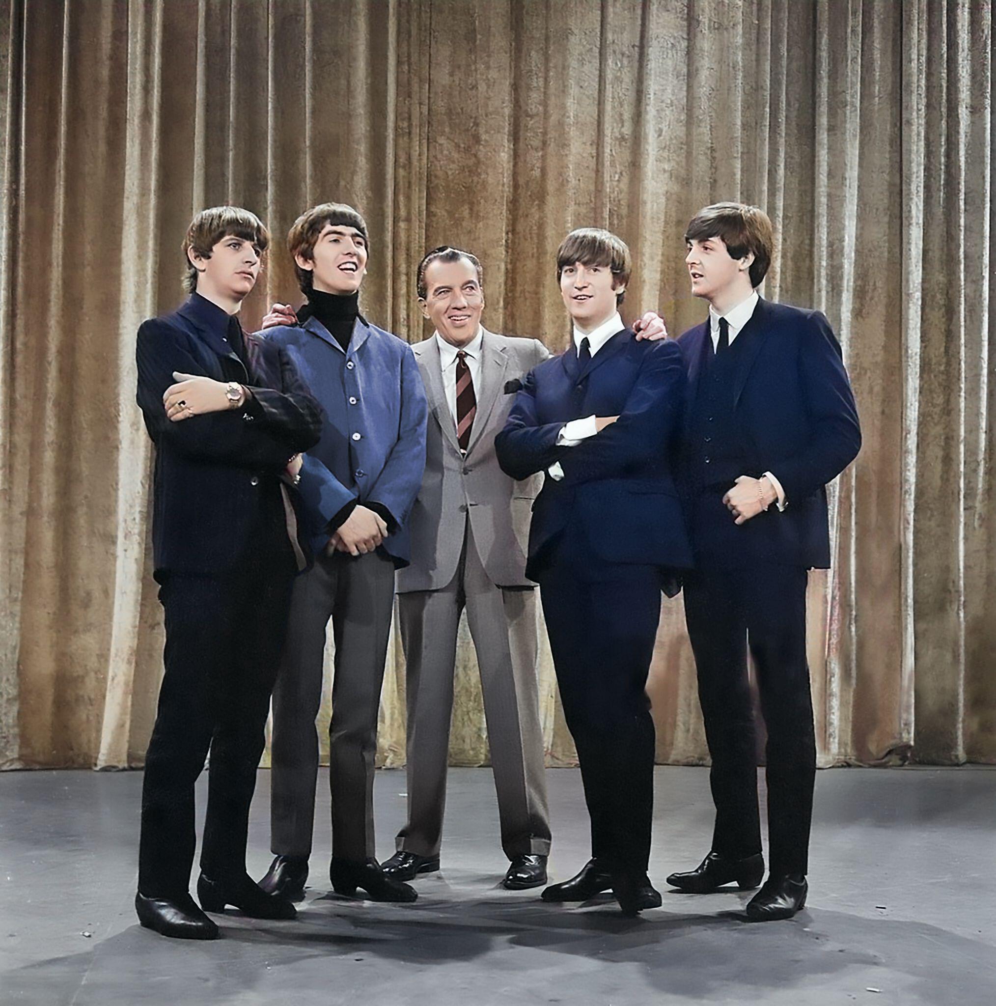 The Beatles became known for cosmopolitan suits and slick mop haircuts (Alamy/PA)