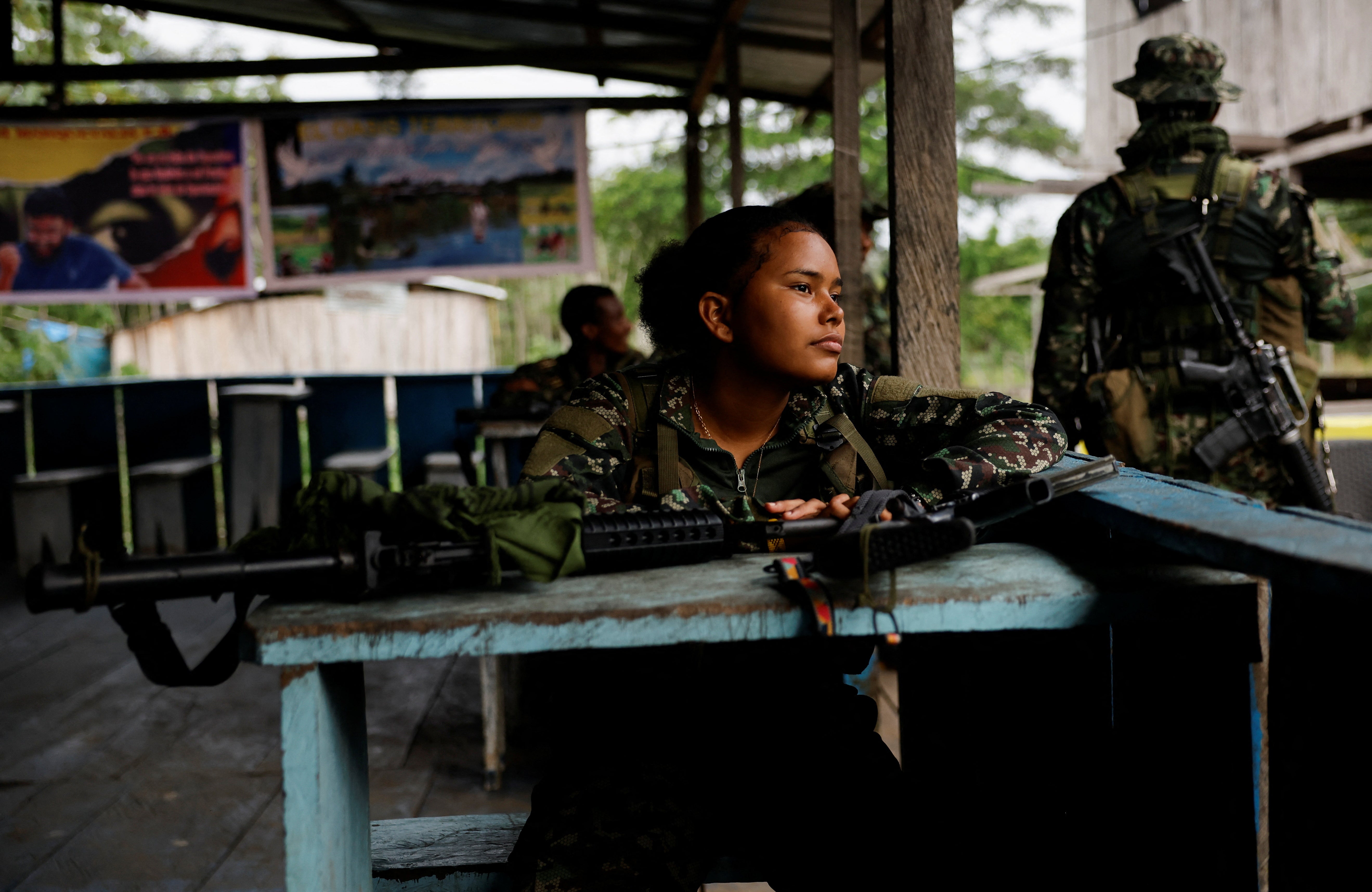 Guerillas of Colombian rebel group Segunda Marquetalia take a break before going on patrol,