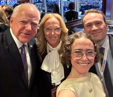 Harris' running mate Tim Walz (left) poses with Kerstin Emhoff (center), Ella Emhoff and Cole Emhoff.