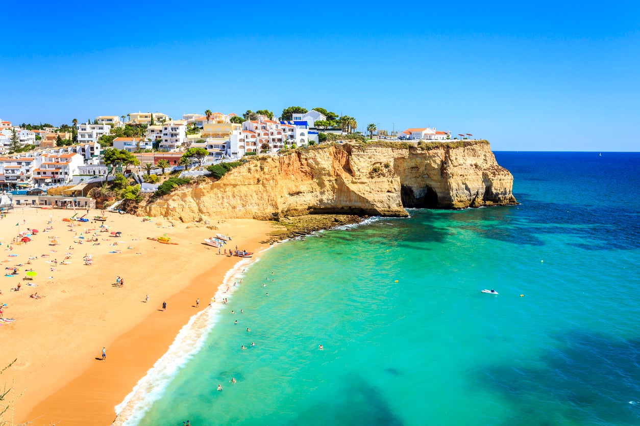 A beach and the surrounding architecture in Carvoeiro, Algarve, Portugal