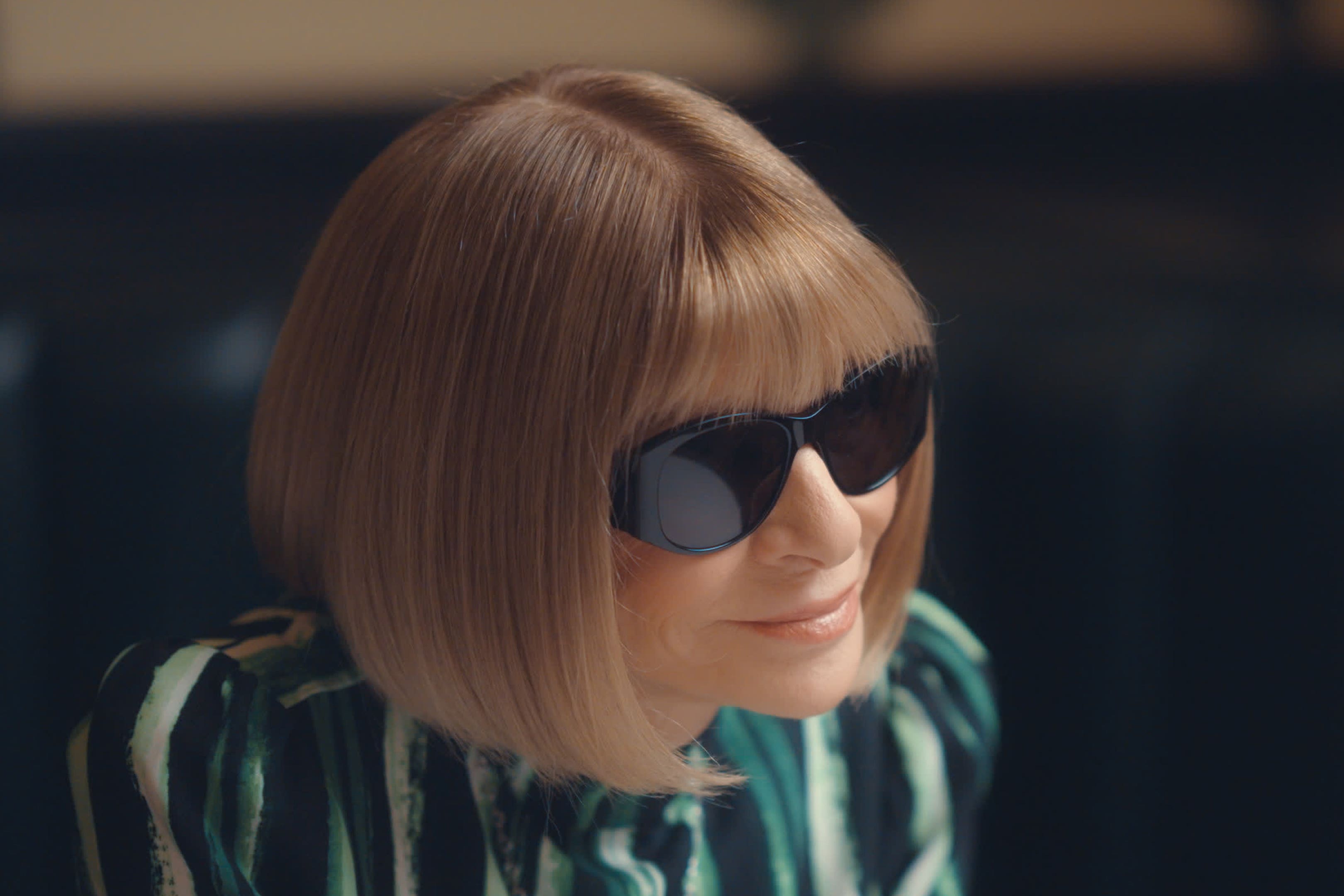 Anna Wintour leans into camera in interview for In Vogue: The 90s documentary