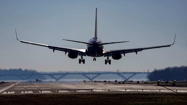 <p>A Southwest plane lands at Ronald Reagan Washington National Airport in Arlington</p>
