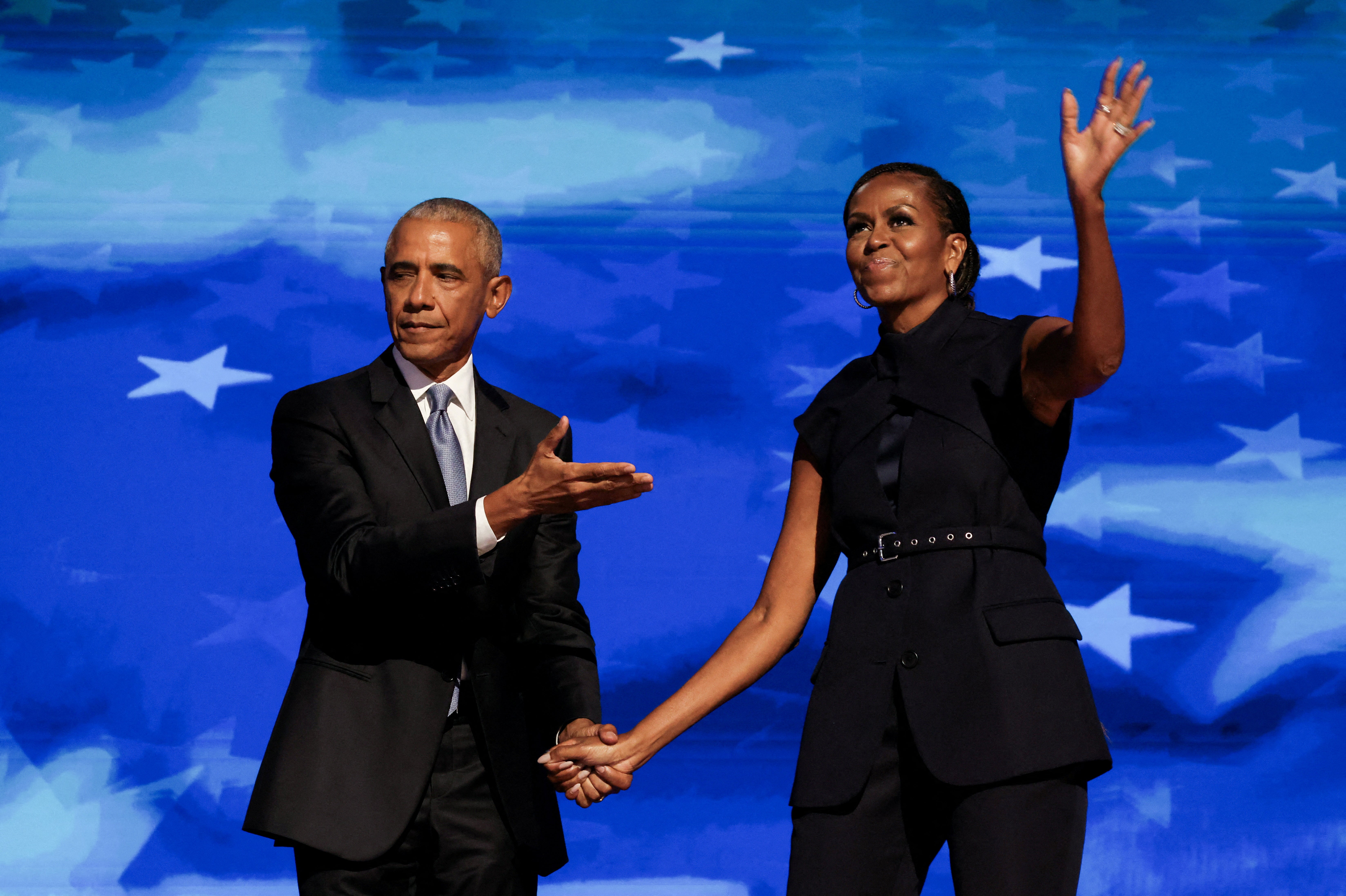 Michelle Obama and her husband, former President Barack Obama, at the Democratic National Convention in Chicago. Hours before the former first couple took the stage, Trump said he ‘happens to like and respect’ them