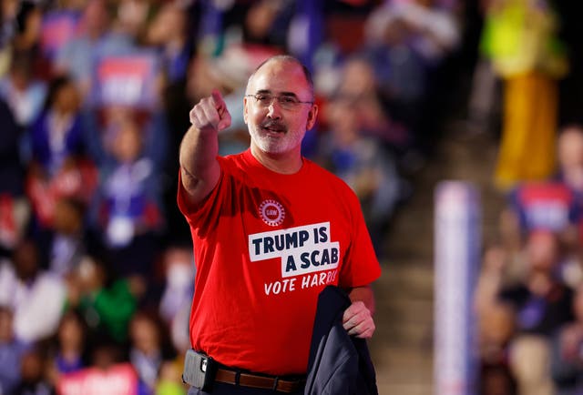 <p>UAW President Shawn Fain wore a shirt at the DNC that read ‘Trump is a scab. Vote Harris’ </p>