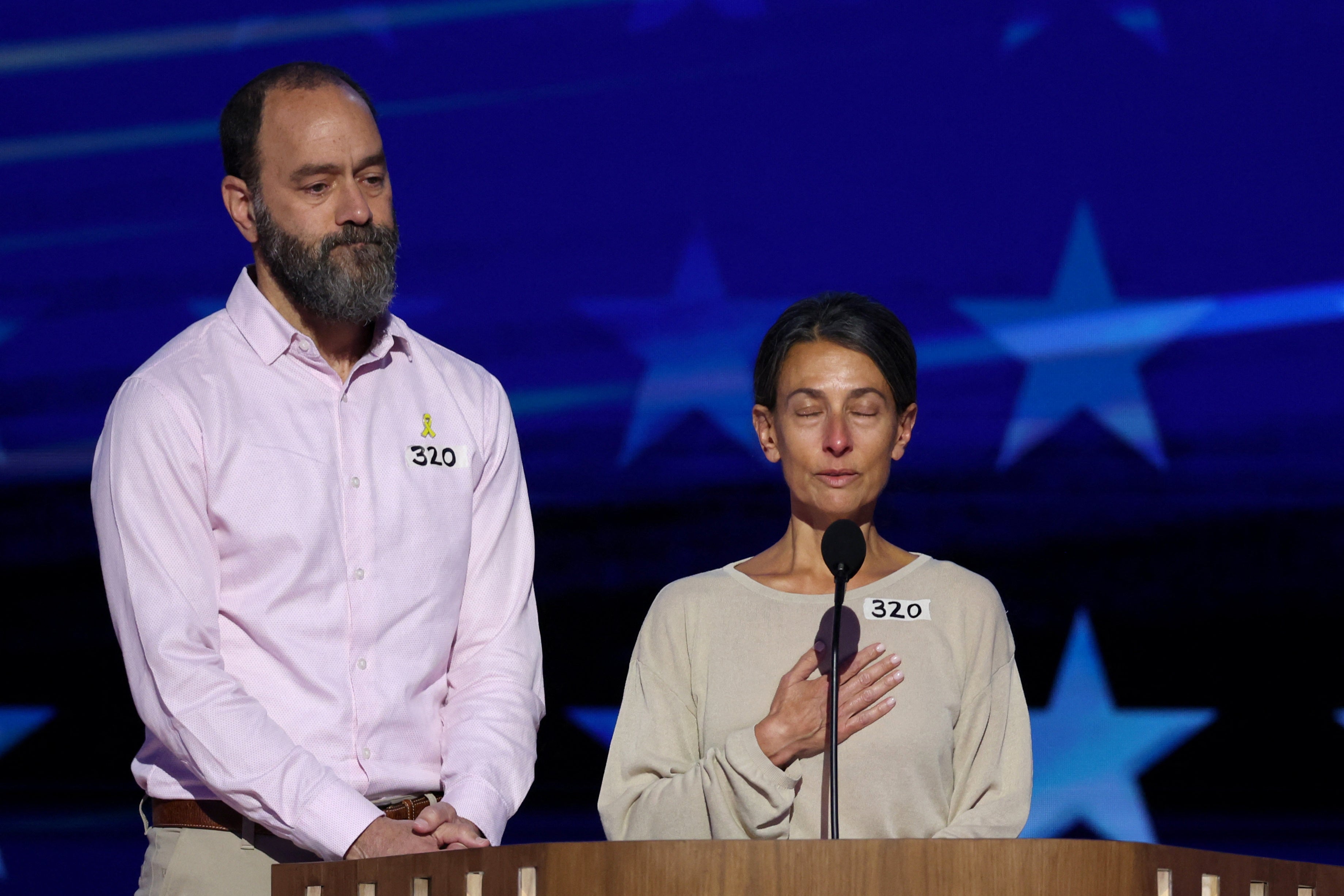 Jon Polin and Rachel Goldberg, parents of hostage Hersh Goldberg-Polin, on stage after speaking during the Democratic National Convention on Wednesday