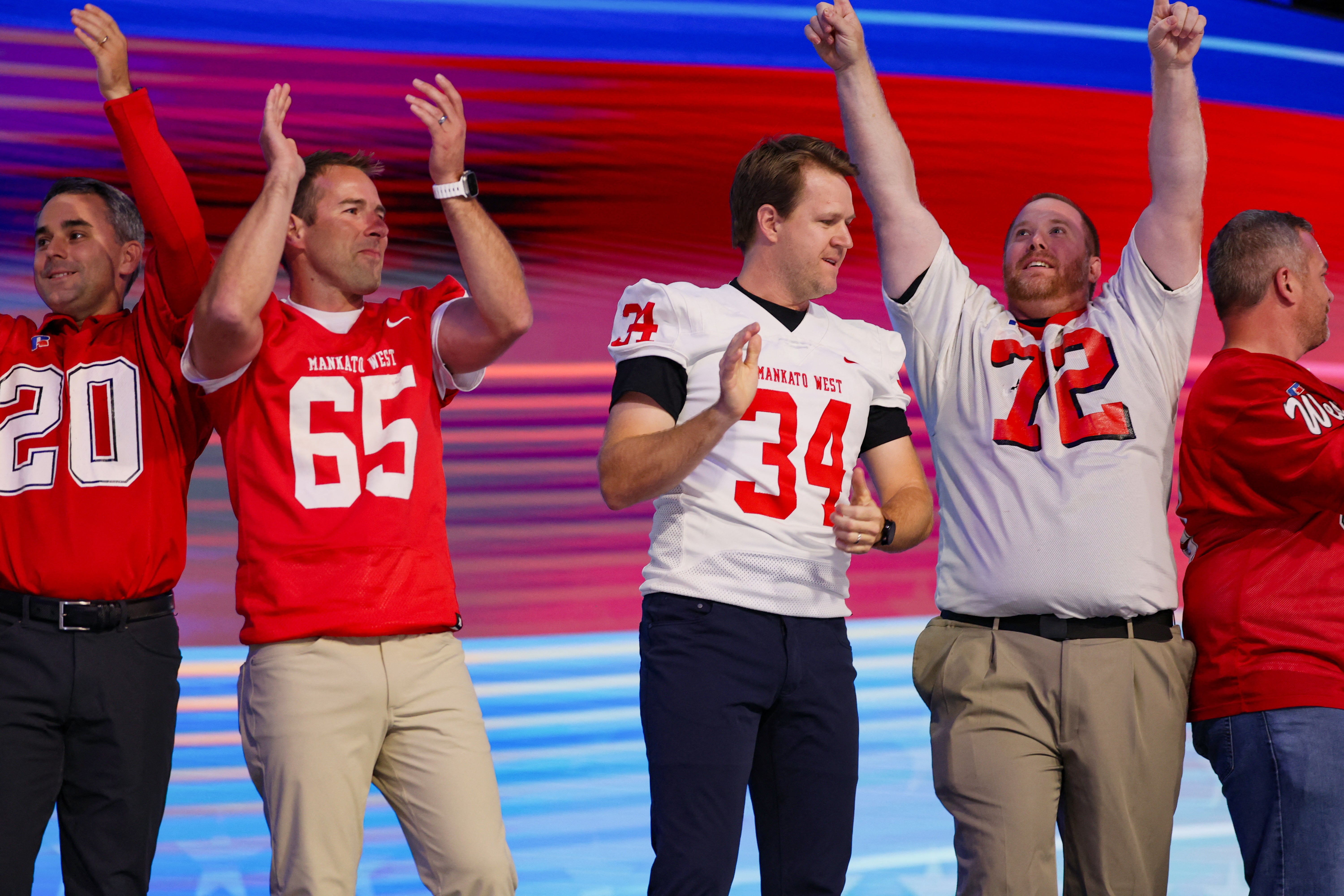 Former football players from Mankato West High School in Minnesota introduced Tim Walz before he accepted the Democratic Party’s vice presidential nomination at the party’s convention in Chicago on August 22.