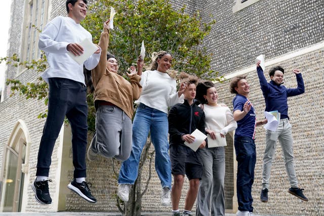 Pupils at Brighton College receiving their GCSE results (Gareth Fuller/PA)