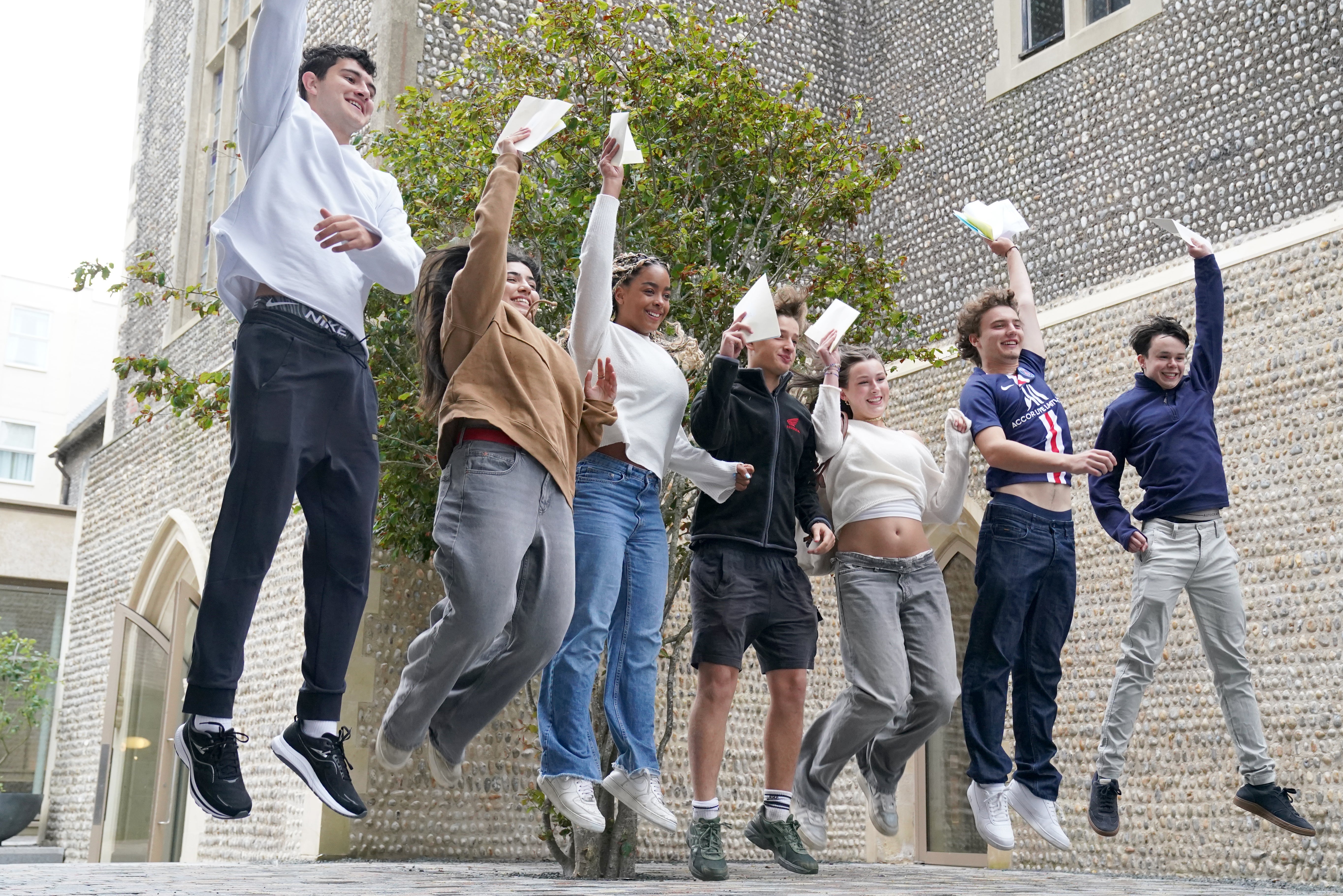 Students jump for joy after getting the grades they wanted