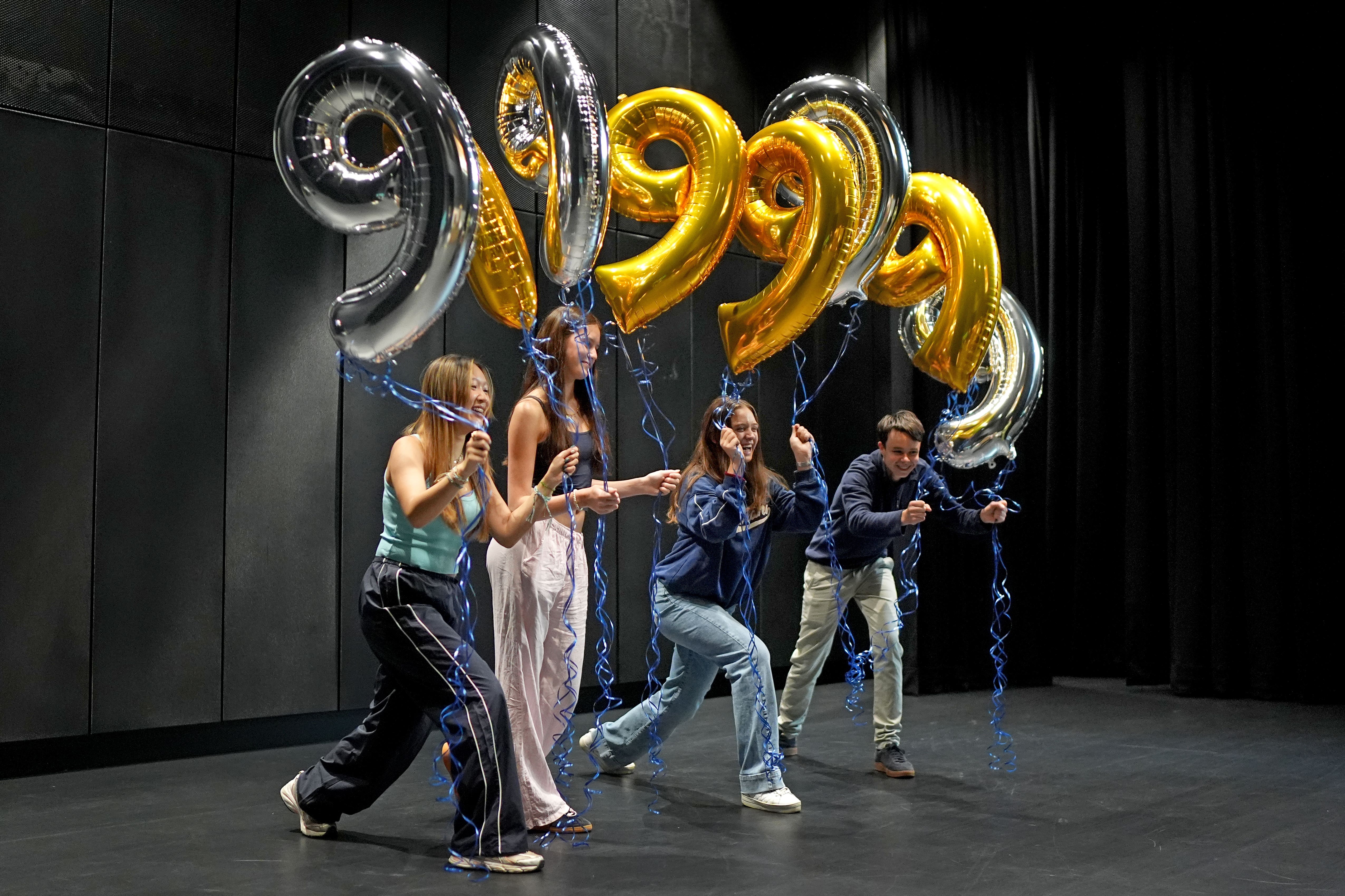 Pupils at Brighton College after receiving nine 9s in their GCSE results (Gareth Fuller/PA)