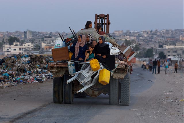 <p>Displaced Palestinians travel on a cart after fleeing the western part of Khan Younis, following an evacuation order by the Israeli army</p>