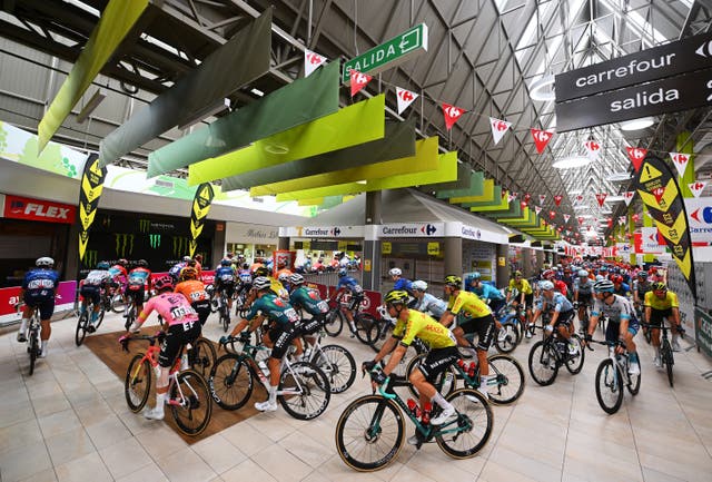 <p>The peloton set off from inside a Carrefour supermarket in Spain </p>