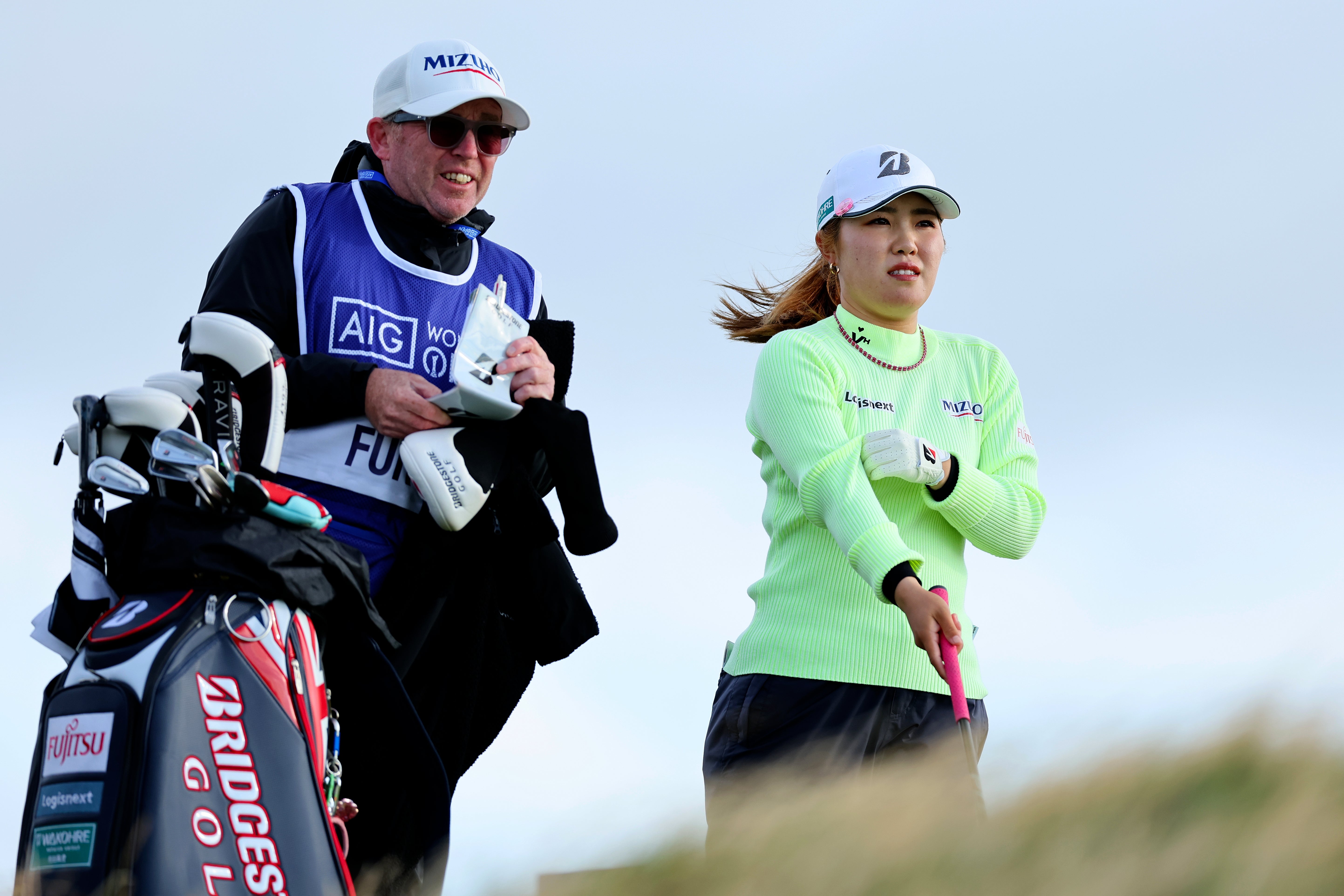 Ayaka Furue of Japan and her caddie discuss a shot on the 12th tee