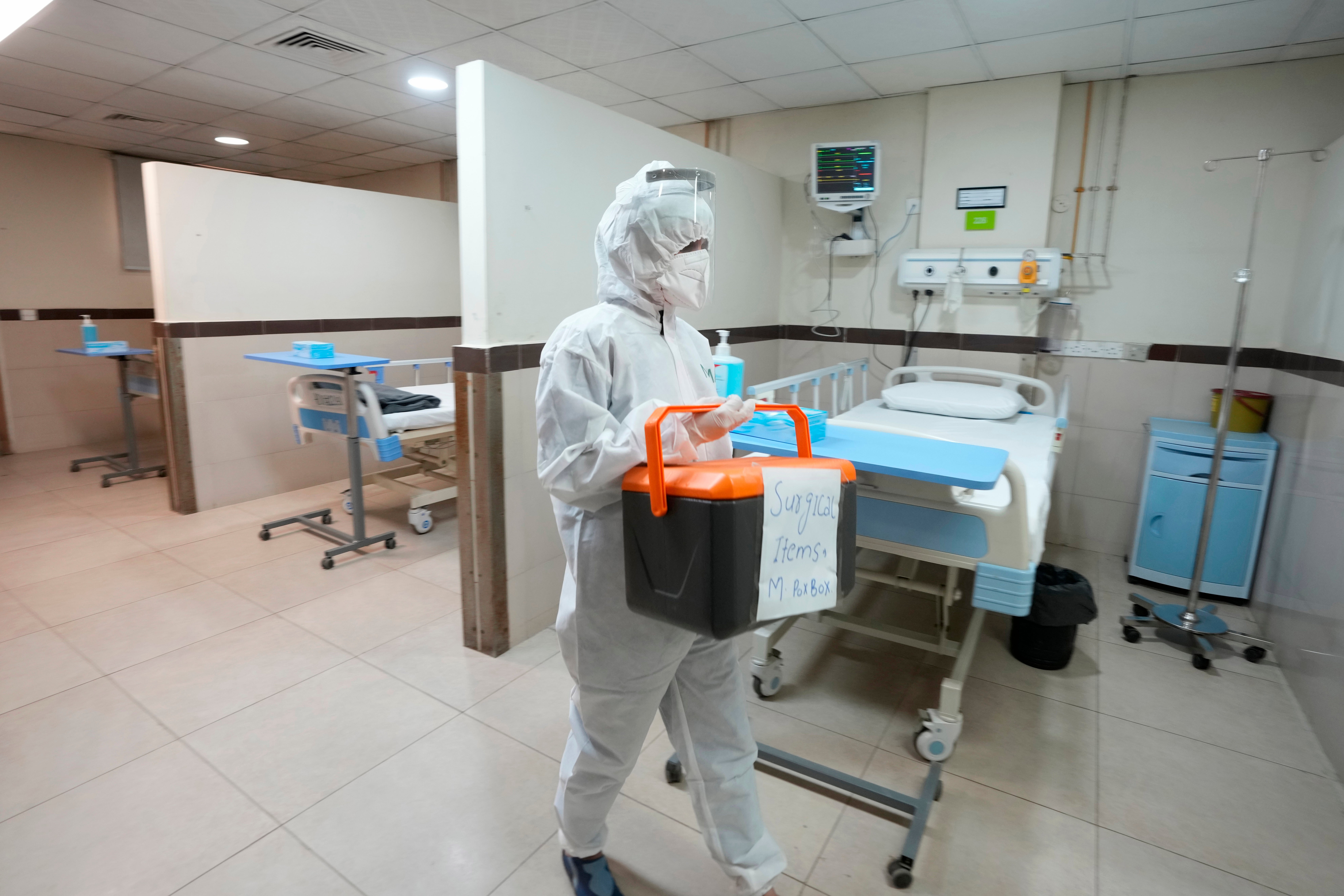 A paramedical staff member prepares an isolation ward set up as a preventative measure following Pakistan's health ministry confirmation of a case of mpox in the Khyber Pakhtunkhwa province