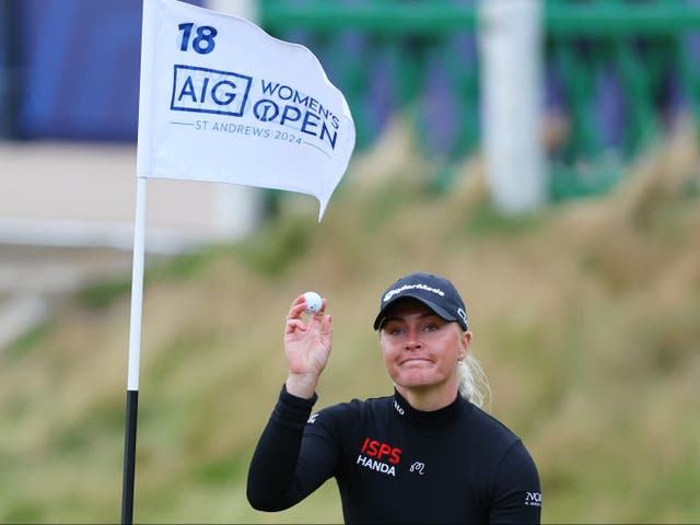 <p>Charley Hull of England reacts to her birdie on the 18th green</p>