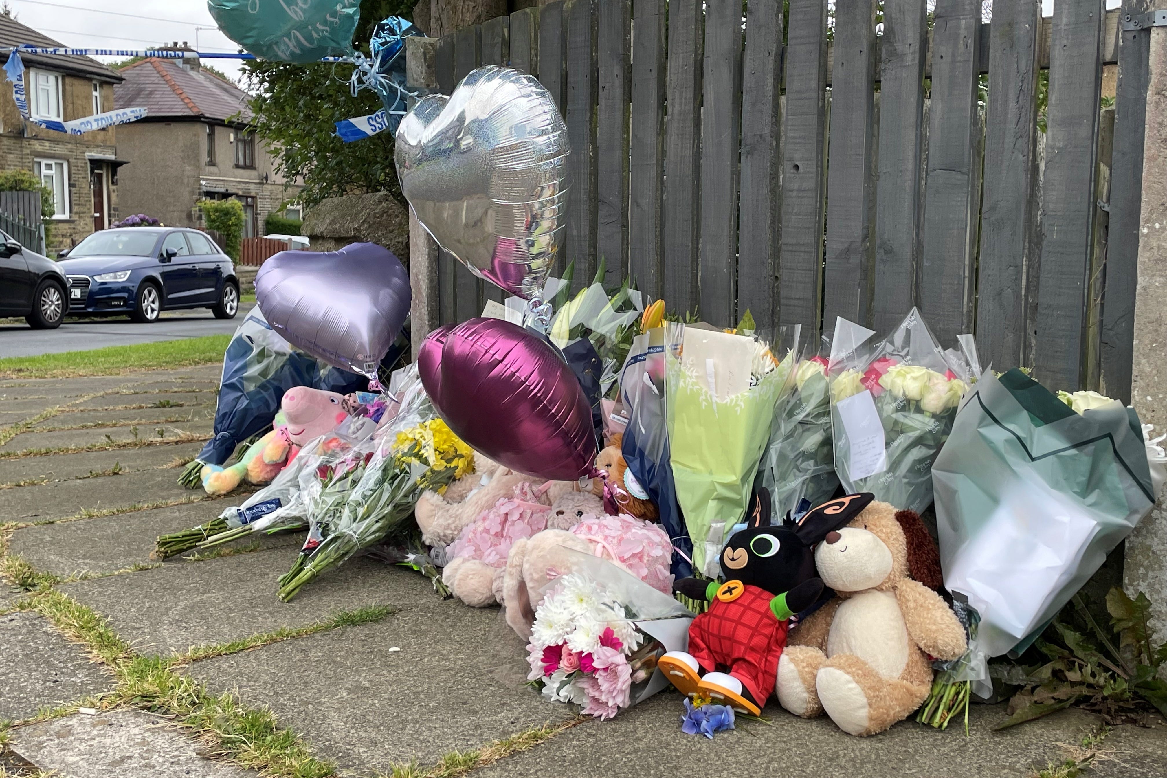 Flowers and tributes near the scene of a fatal house fire in Bradford (Dave Higgins/PA)