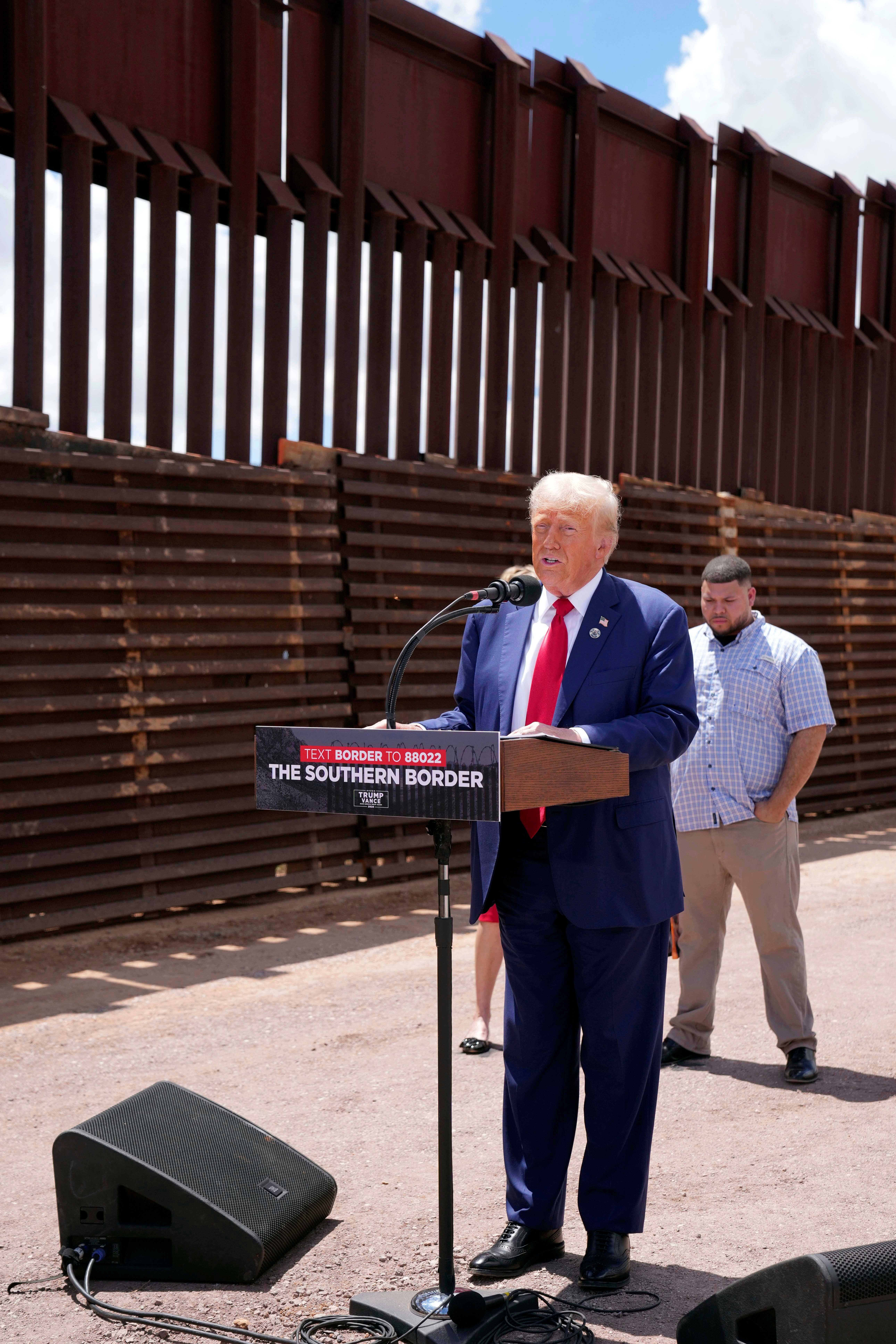 Trump speaks during a campaign event in front of the US-Mexico border in August