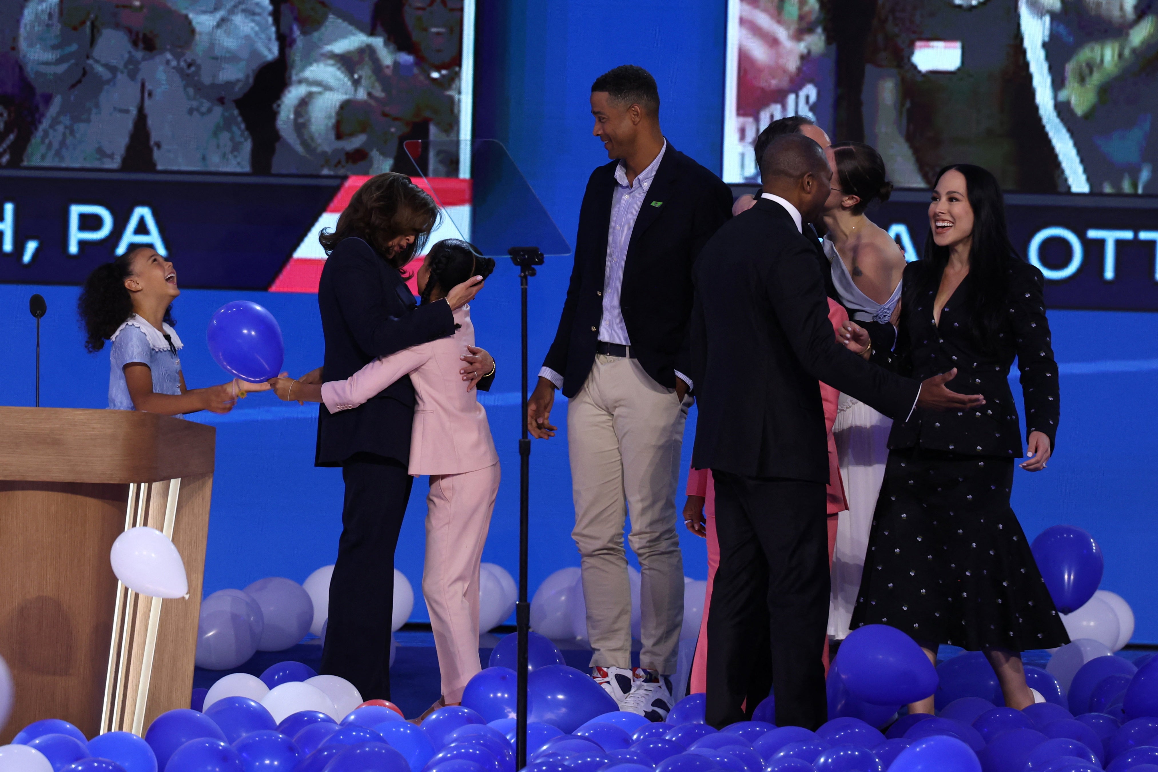 Kamala Harris celebrates with her great-nieces Amara and Leela after her acceptance speech for the Democratic nomination