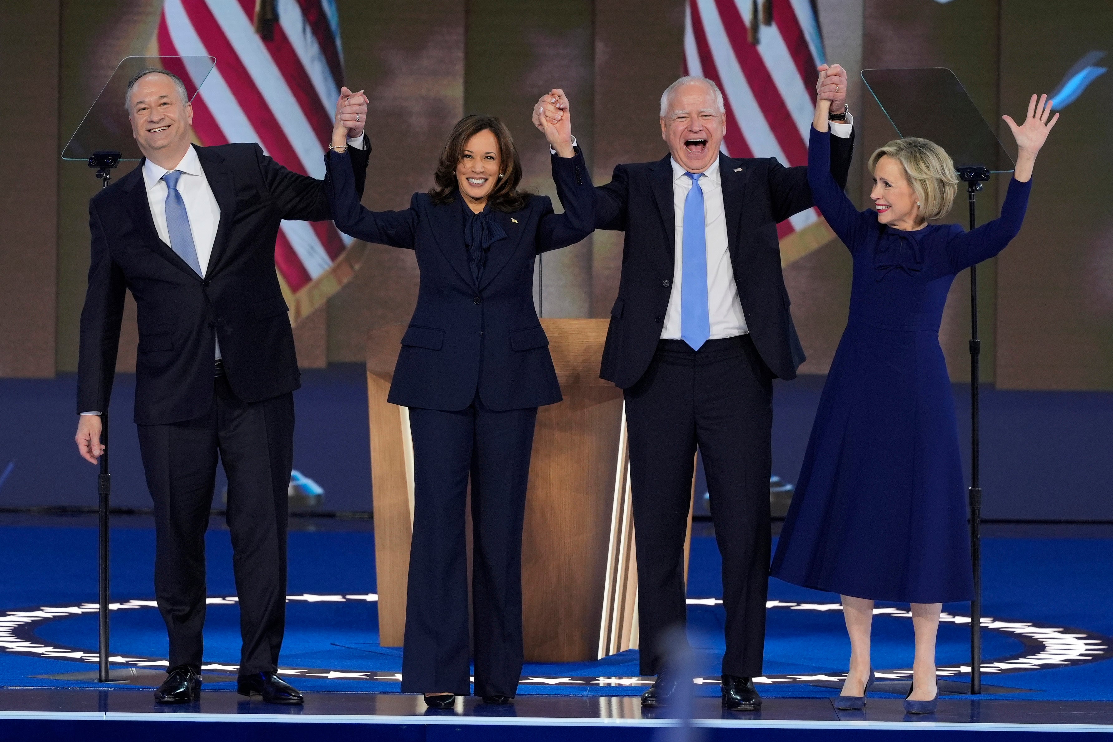 Doug Emhoff, Kamala Harris, Tim Walz and his wife Gwen Walz together on stage