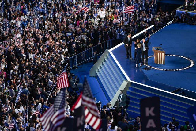 <p>Democratic presidential candidate Kamala Harris stands onstage with Second Gentleman Douglas Emhoff, Minnesota Governor and Democratic vice presidential candidate Tim Walz and Gwen Walz at the end of the fourth and last day of the Democratic National Convention (DNC) at the United Center in Chicago, Illinois, on August 22</p>