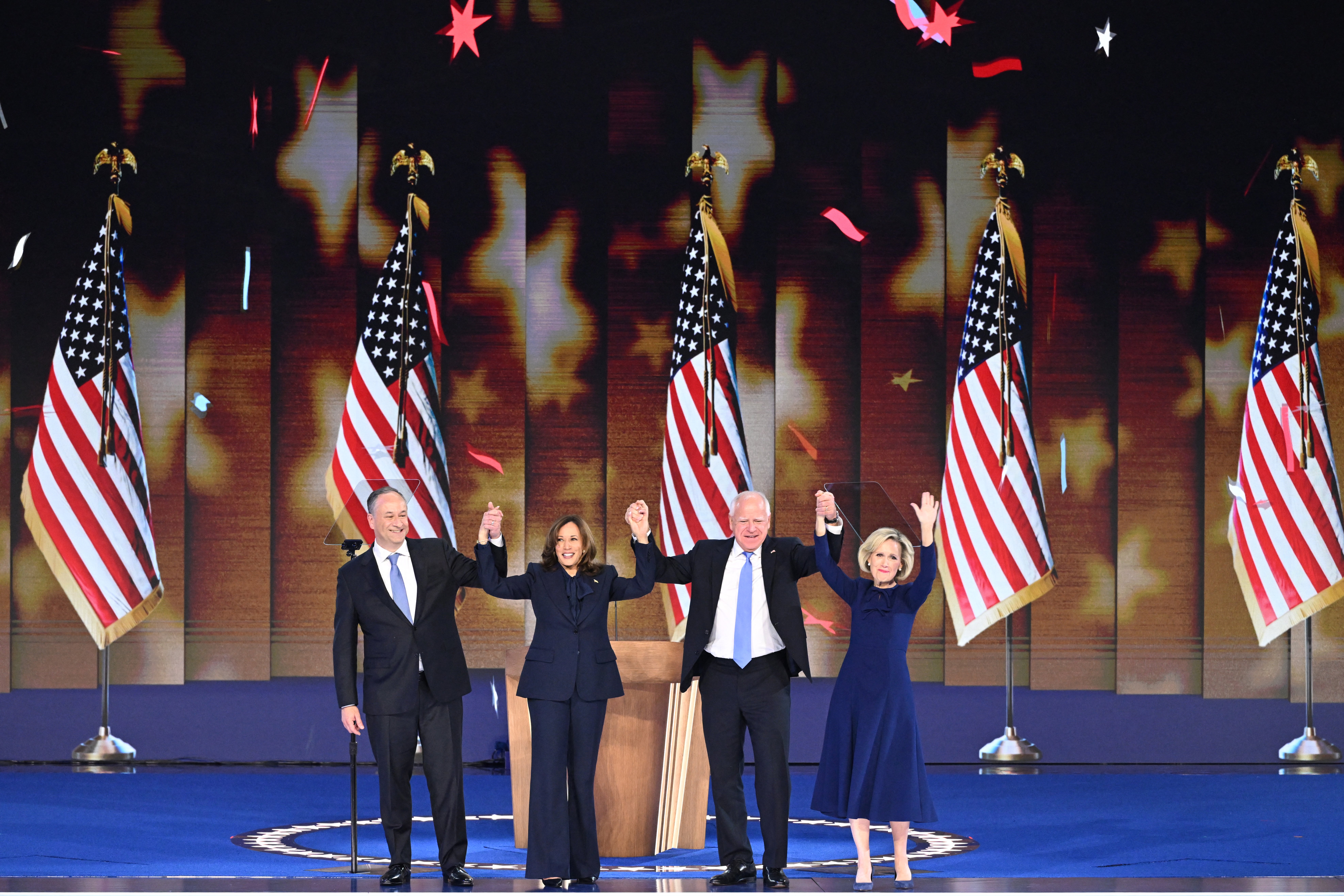 Democratic presidential candidate Kamala Harris on stage with Second Gentleman Douglas Emhoff, Minnesota Governor and Democratic vice presidential candidate Tim Walz and his wife Gwen Walz