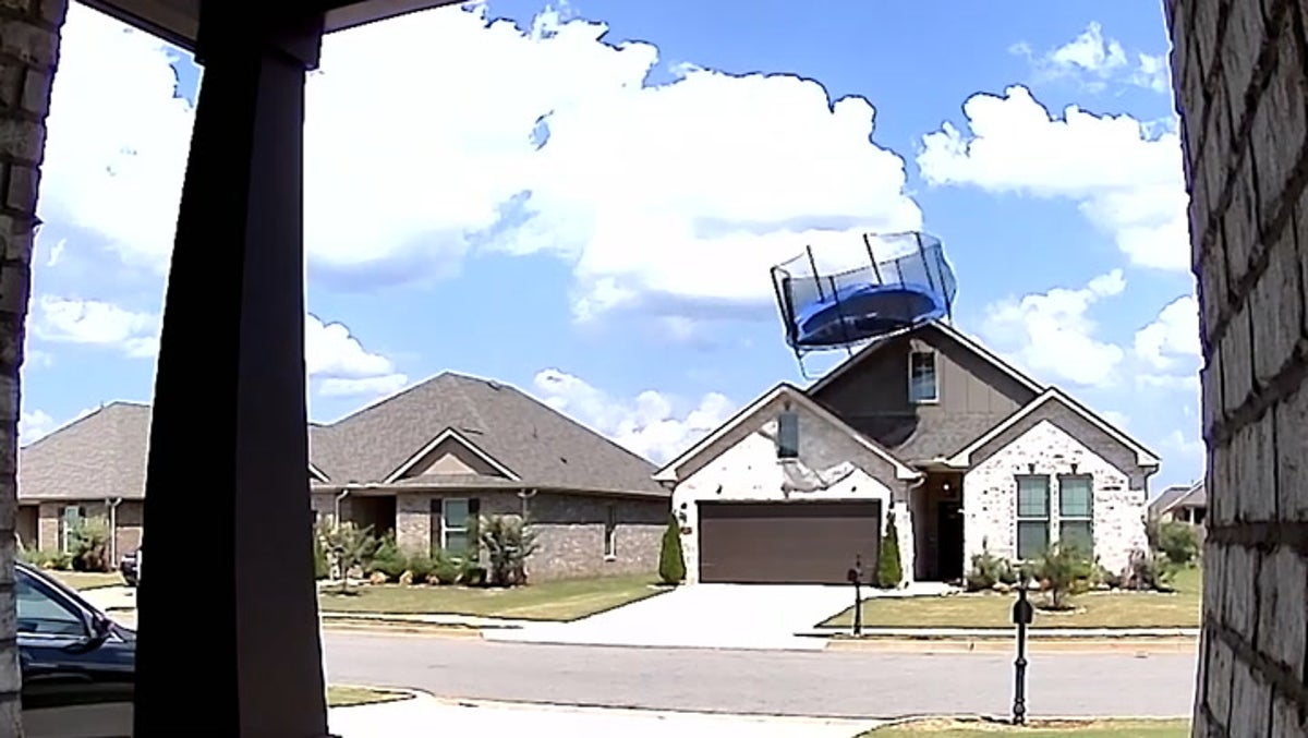 Trampoline crashes into house roof during strong winds