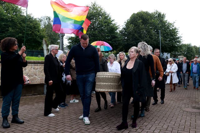 The coffin carrying Nell McCafferty is carried into St Columba’s Church (Liam McBurney/PA)