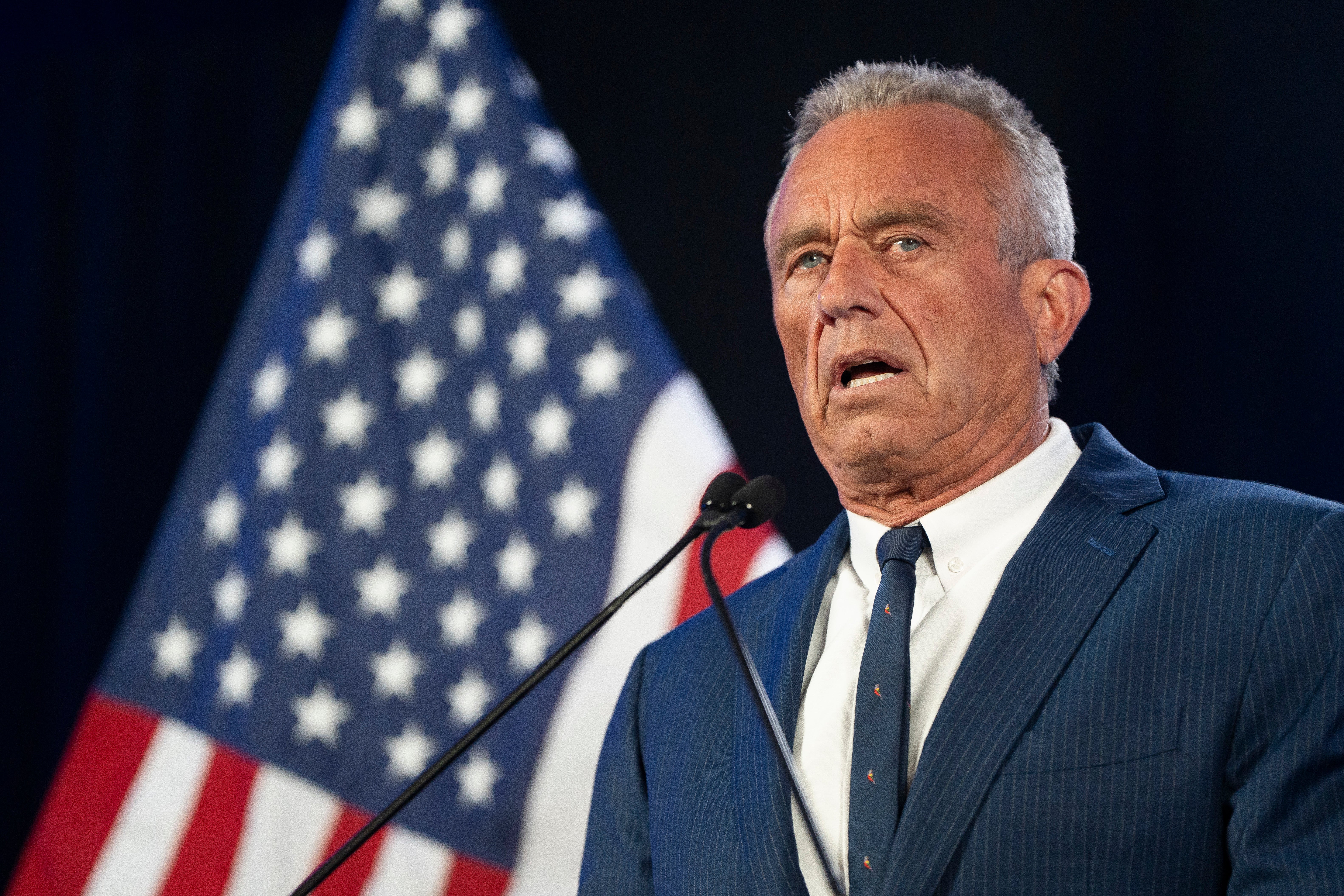 Former Presidential candidate Robert F. Kennedy Jr. speaks to a crowd in Arizona. Kennedy, who suspended his presidential campaign, is under fire from environmental groups after a report alleging he had sawed off the head of a dead whale in the mid-1990s