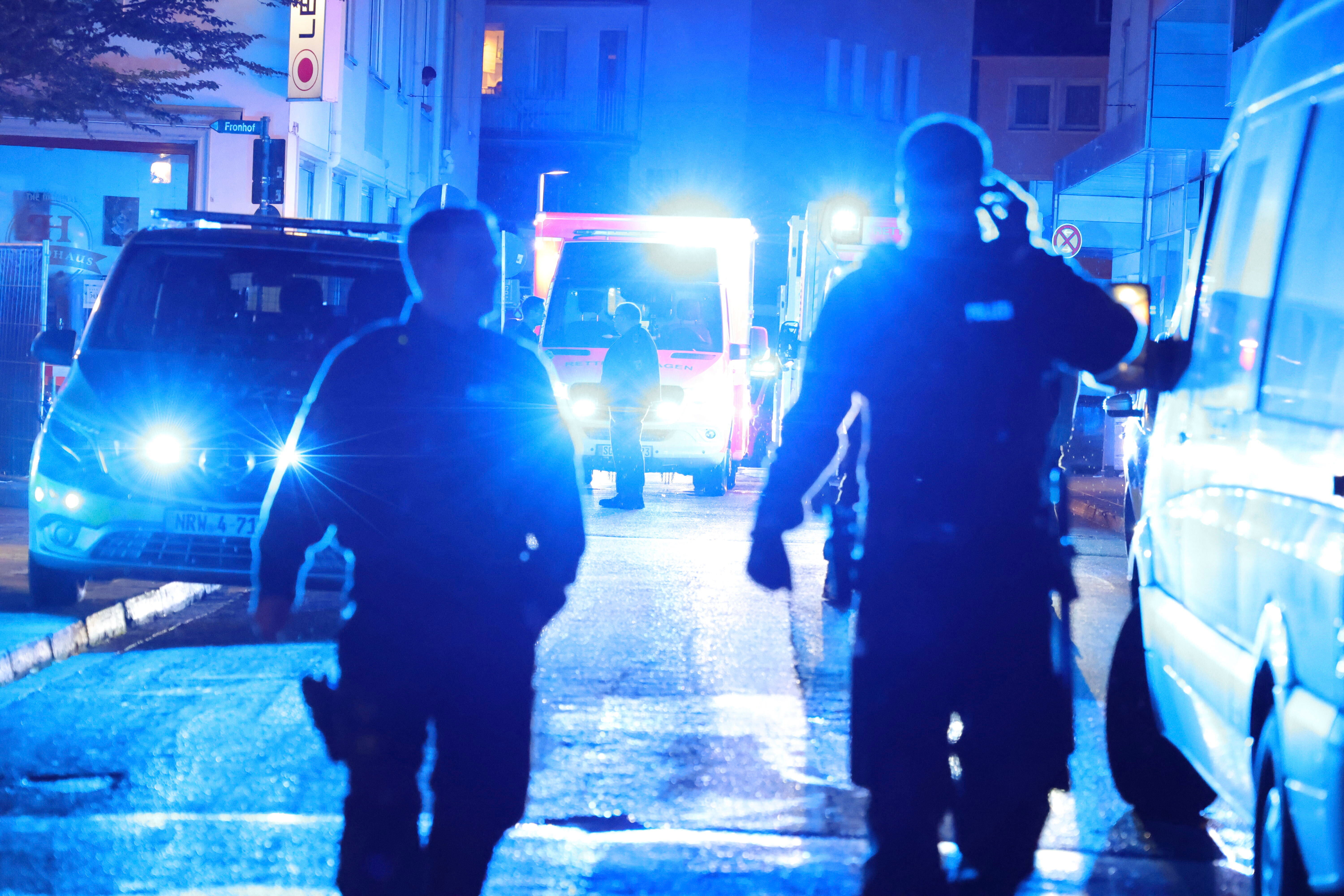 Police and ambulances near the scene where people were killed and injured in an attack at a festival in Solingen, western Germany