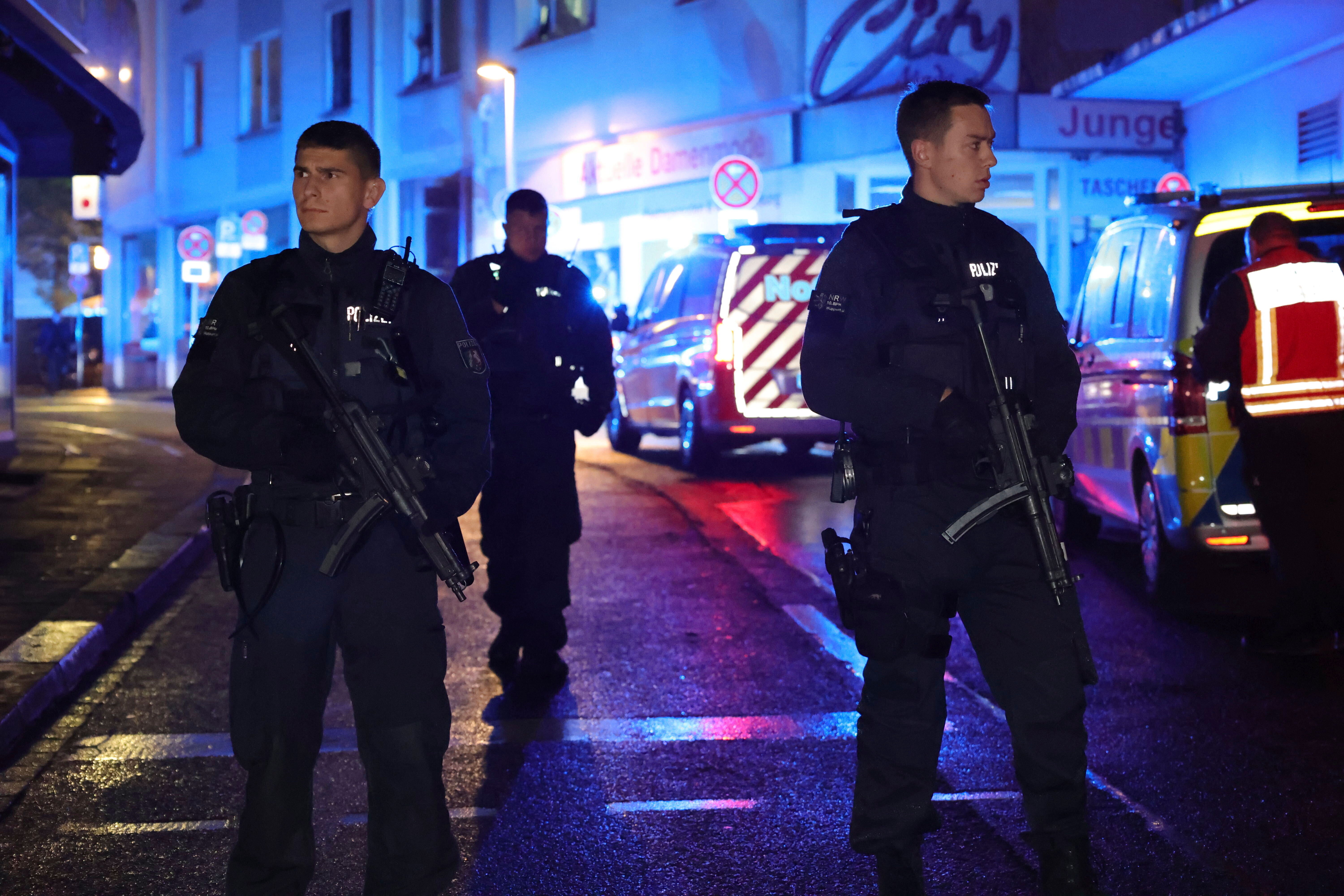 Police and ambulances near the scene where people were killed and injured in an attack at a festival on Friday