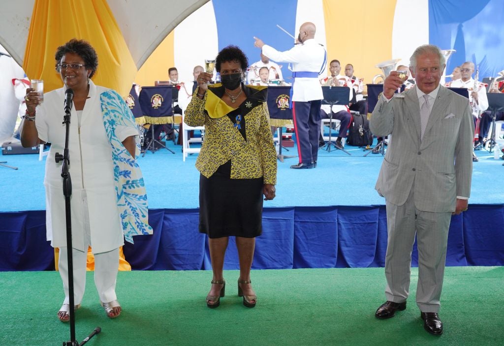 Prince Charles, then Prince of Wales, joins the President of Barbados Sandra Mason (C) and Barbados Prime Minister Mia Mottley (L) in a toast to the nation during a reception hosted by the President of the Republic at State House on November 30, 2021 in Bridgetown, Barbados. The Prince of Wales arrived in the country ahead of its transition to a republic within the Commonwealth