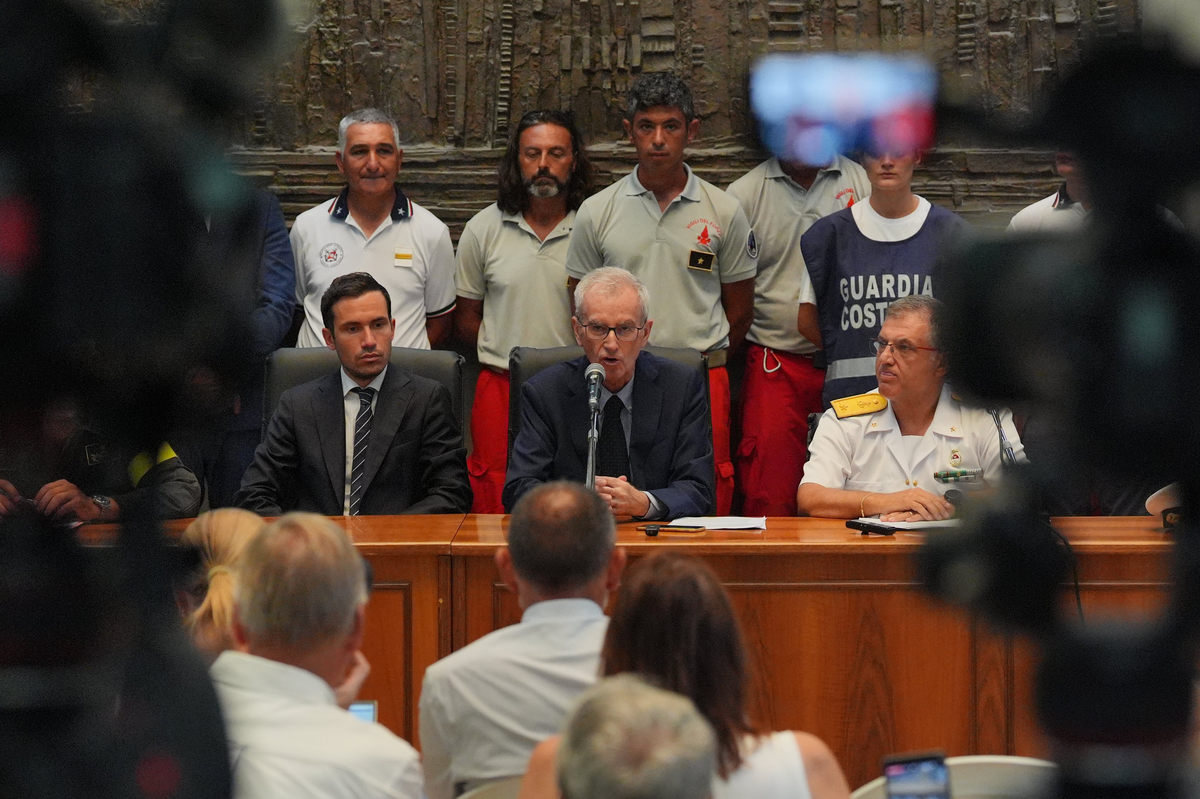 (Centre left to right) Prosecutor Raffaele Cammarano, Chief prosecutor Ambrogio Cartosio and maritime director of western Sicily Rear Admiral Raffaele Macauda of the coastguard