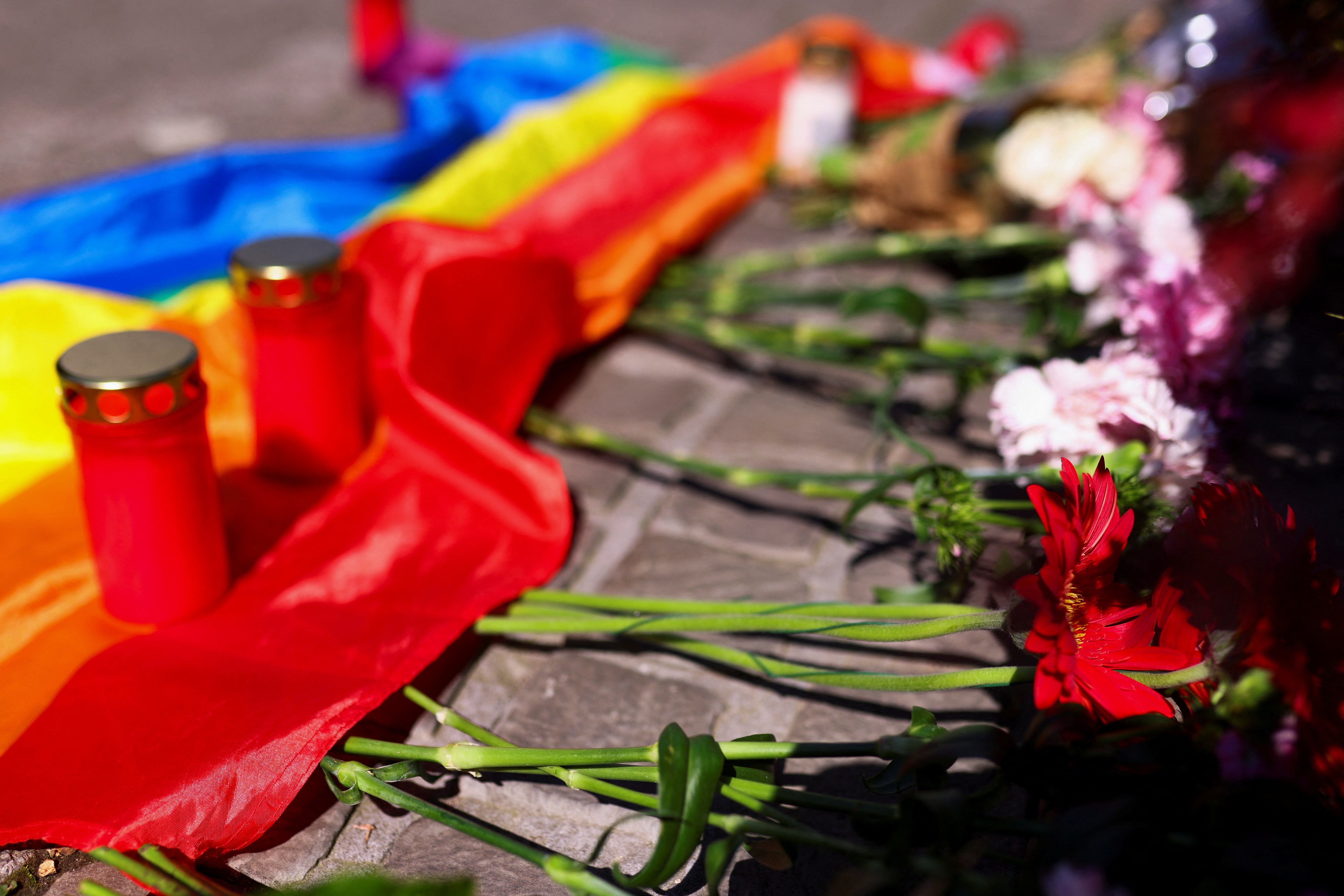 Flowers, candles and a rainbow flag at the scene following a mass stabbing at a festival in Solingen