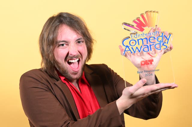 <p>The comedian Joe Kent-Walters poses with his Best Newcomer award, from the Edinburgh Comedy Awards</p>
