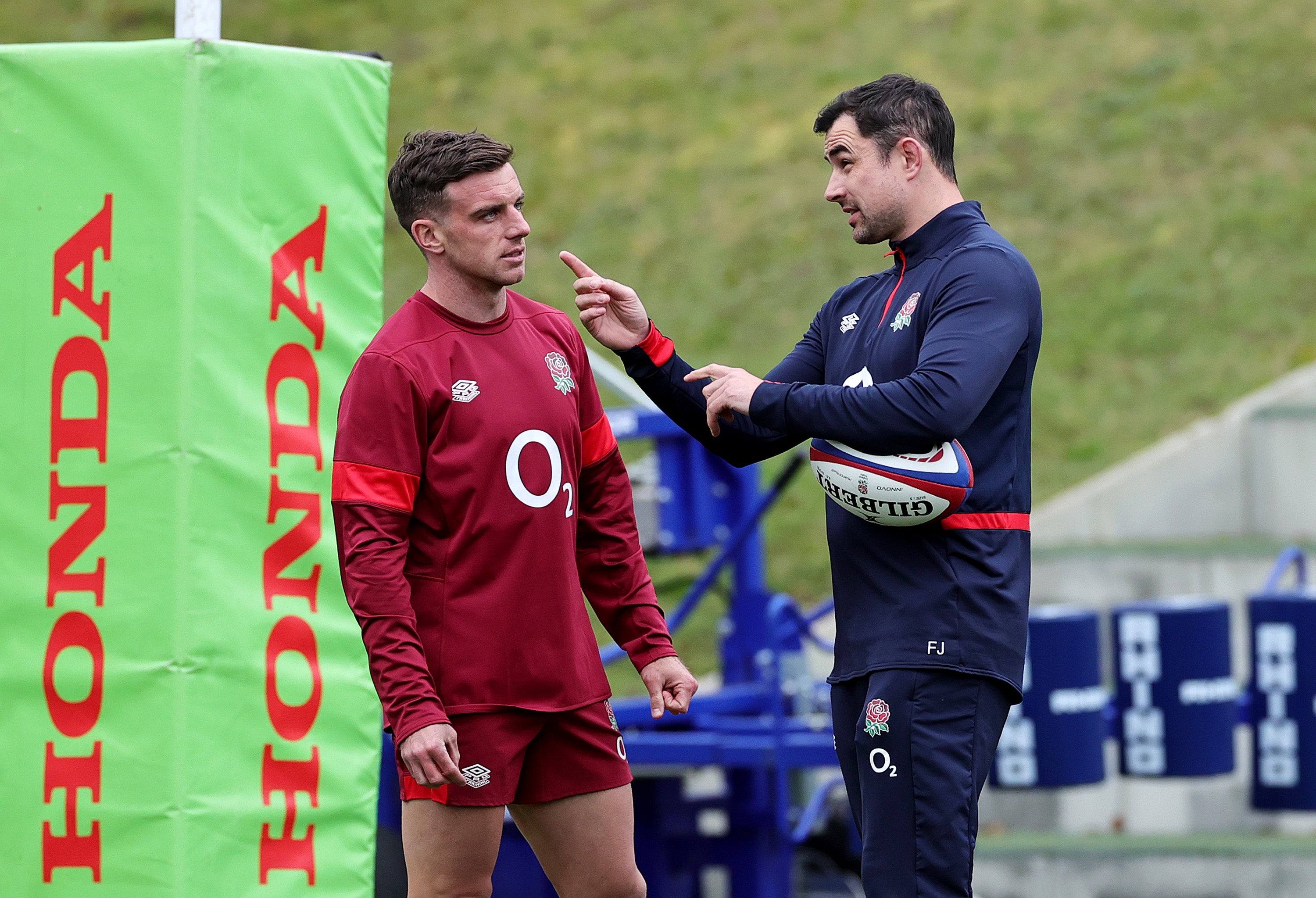 George Ford of England speaks with coach Felix Jones in Bagshot