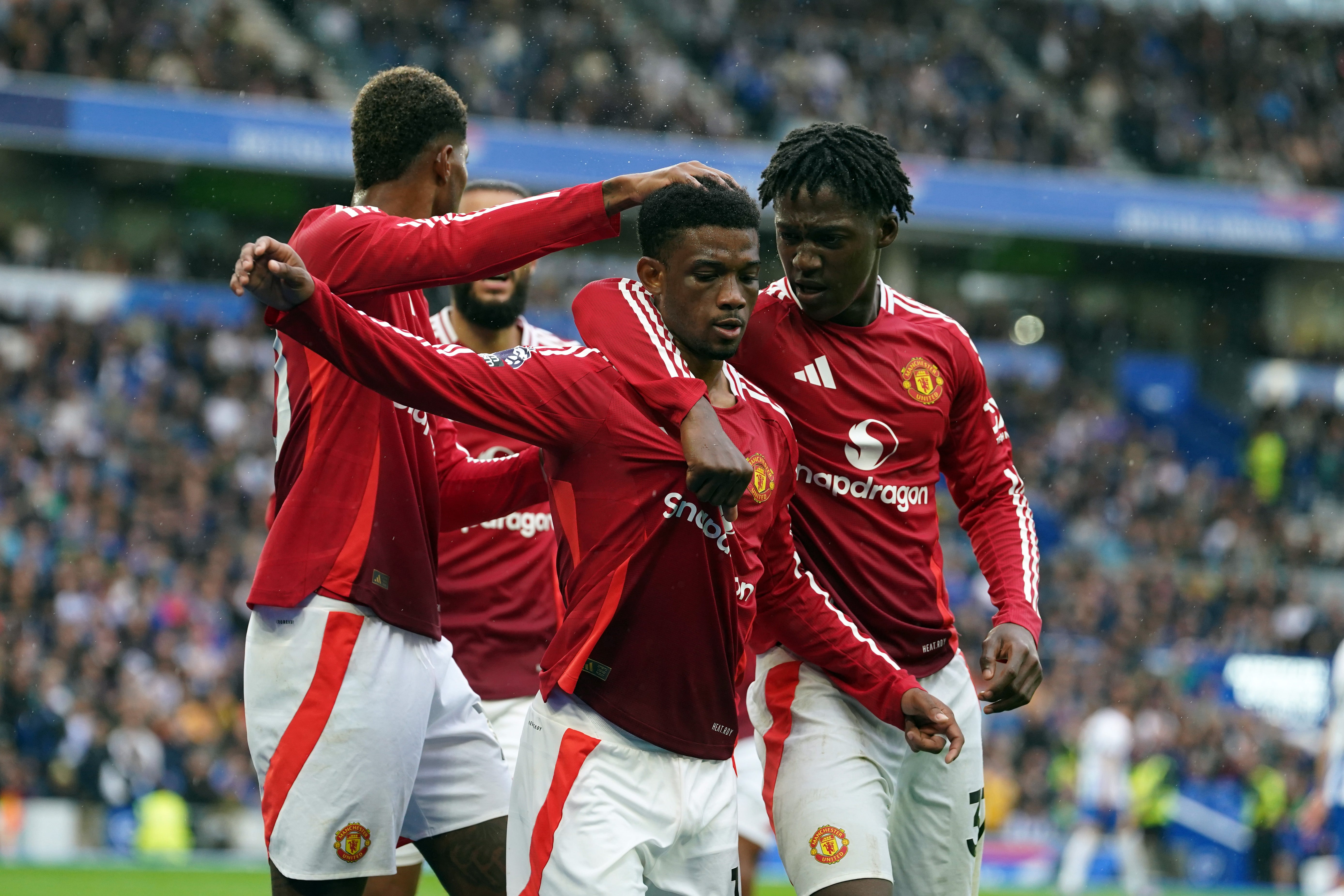 Amad Diallo (centre) celebrates scoring Manchester United’s goal