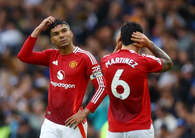 <p>Manchester United's Casemiro looks dejected after the match</p>