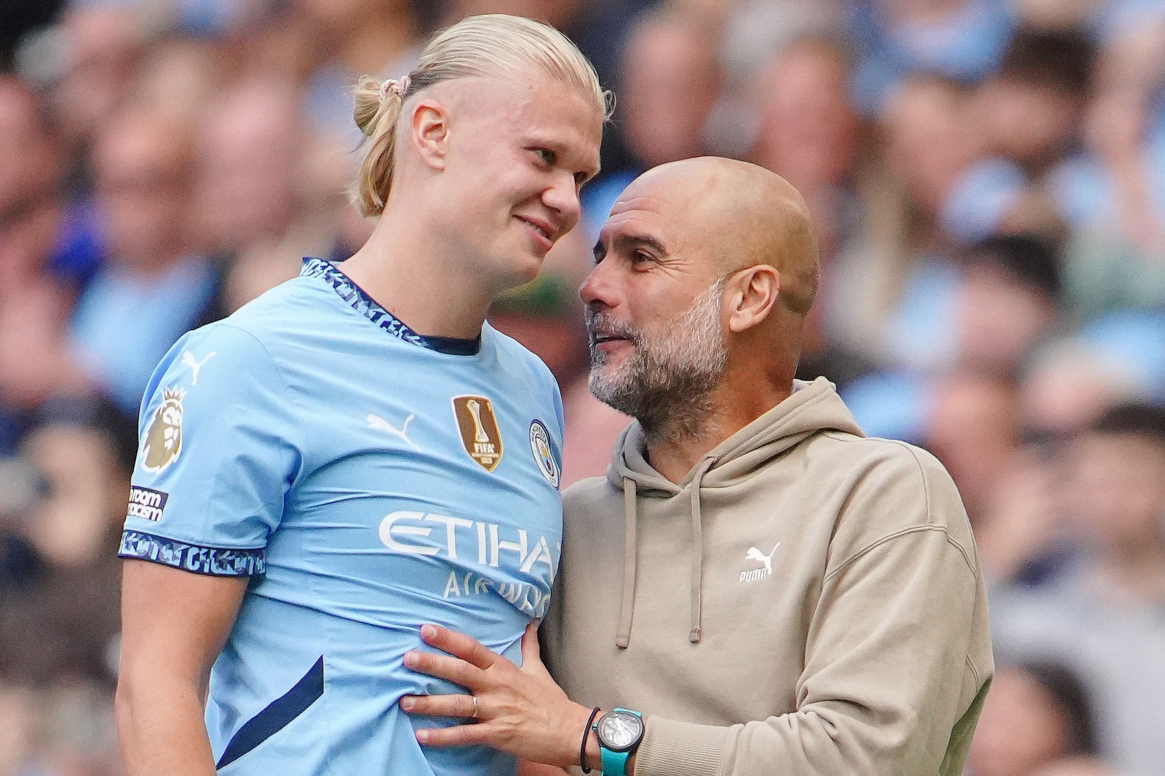 Pep Guardiola (right) is delighted to have Erling Haaland (left) in his team (Peter Byrne/PA)