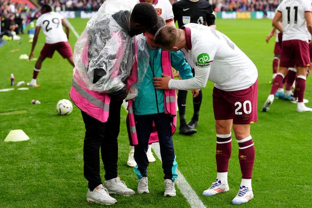 <p>West Ham captain Jarrod Bowen, right, speaks to the Crystal Palace ball boy after the match at Selhurst Park (Zac Goodwin/PA)</p>