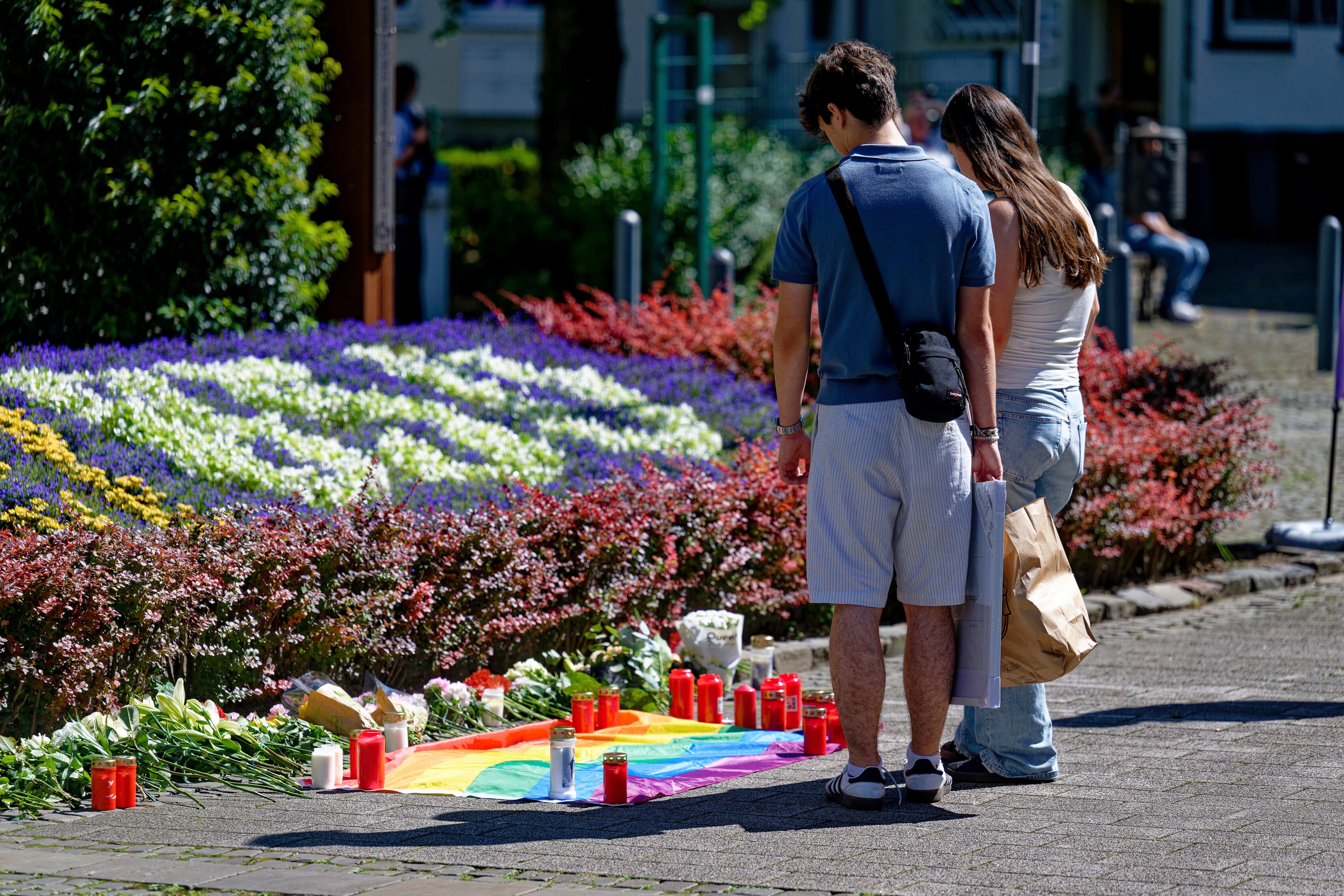 Mourners lay flowers and tributes to the victims of the Solingen attack