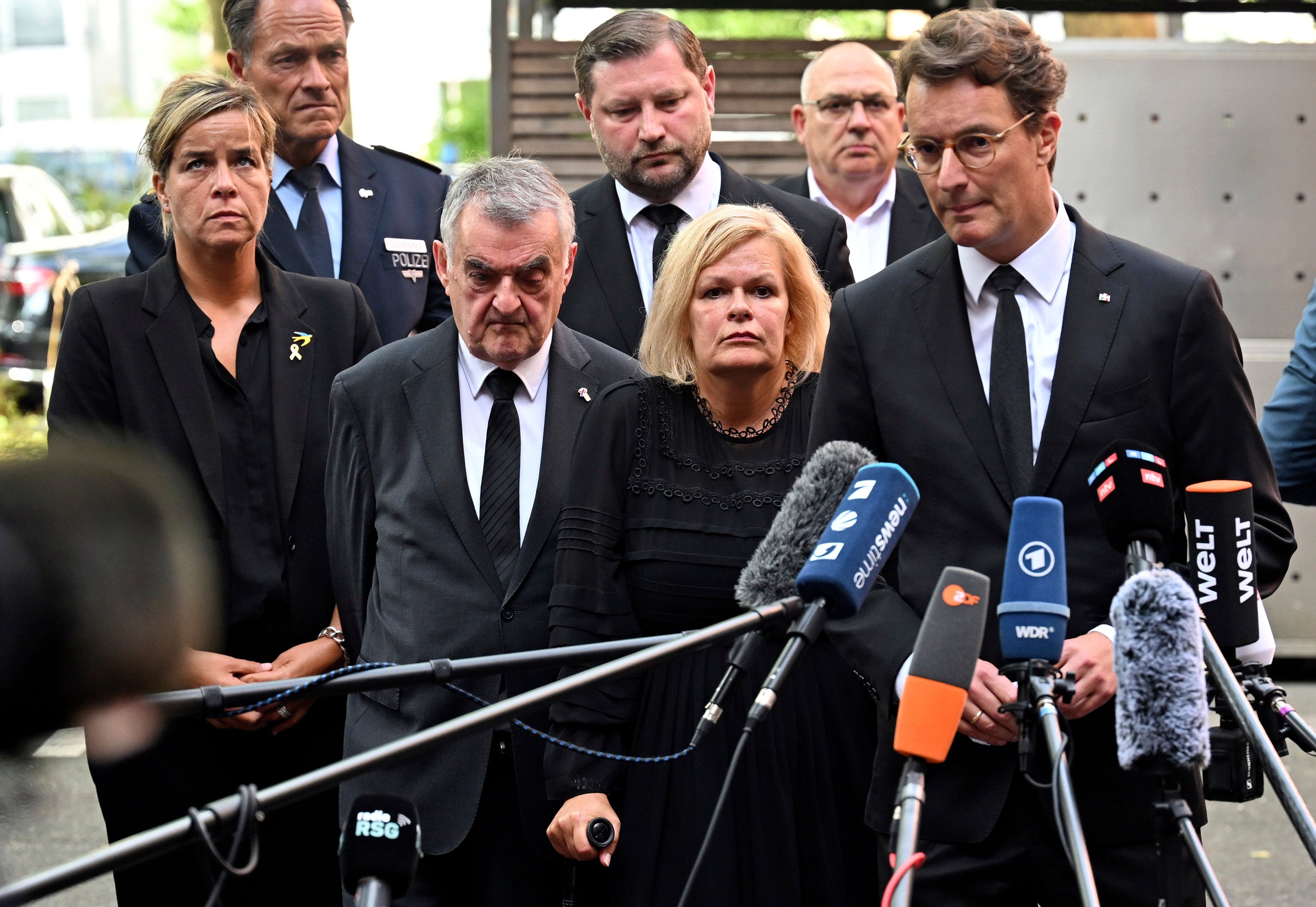 (R-L) Hendrik W'st, Minister President of North Rhine-Westphalia, Federal Minister of the Interior Nancy Faeser, and Herbert Reul, Minister of the Interior of North Rhine-Westphalia address press following the tragedy