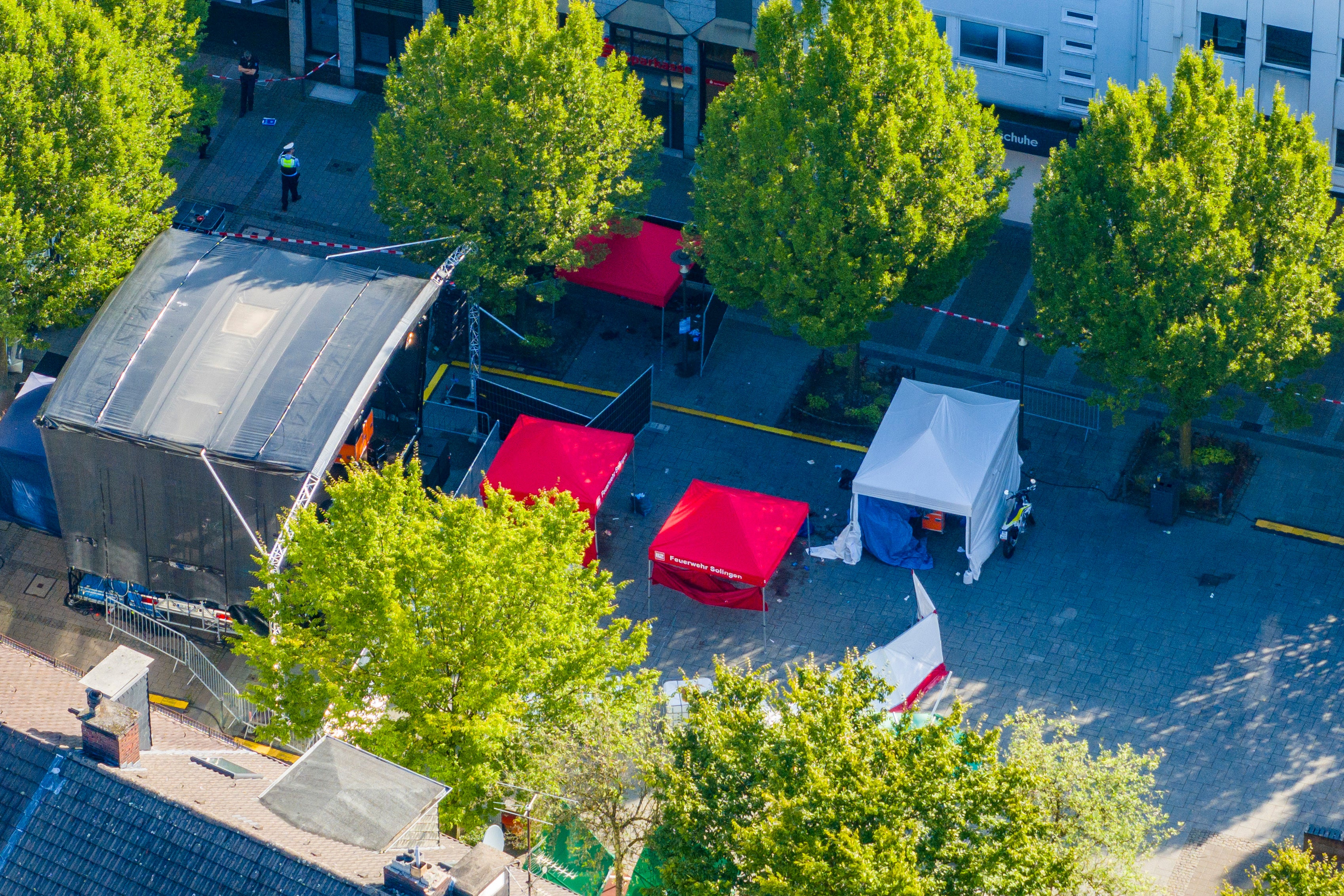 Emergency services tents stand in front of the stage in Solingen’s central square