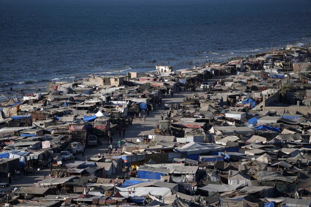 Tents are crammed together as displaced Palestinians camp on the beach (Abdel Kareen Hana/AP)