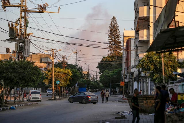 <p>Smoke rises during an Israeli military operation in Salah Al Din road following an evacuation order issued by the Israeli army in Deir Al Balah, central Gaza Strip</p>