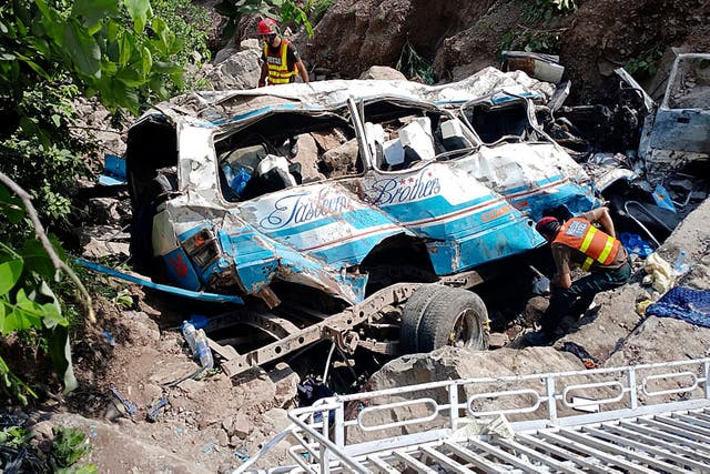 <p>Rescue workers at the scene of a bus crash near Kahuta in Pakistan</p>