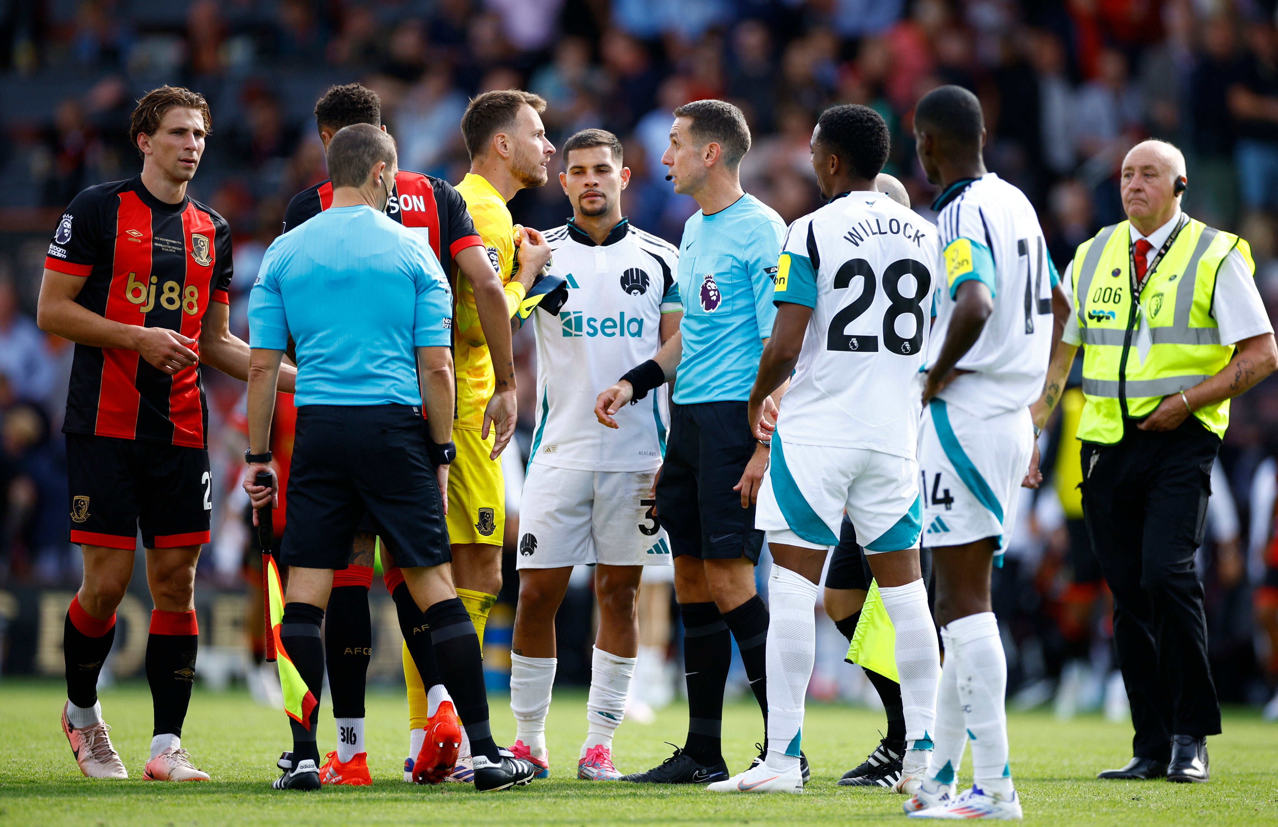 Bournemouth goalkeeper Neto confronts referee David Coote at full-time