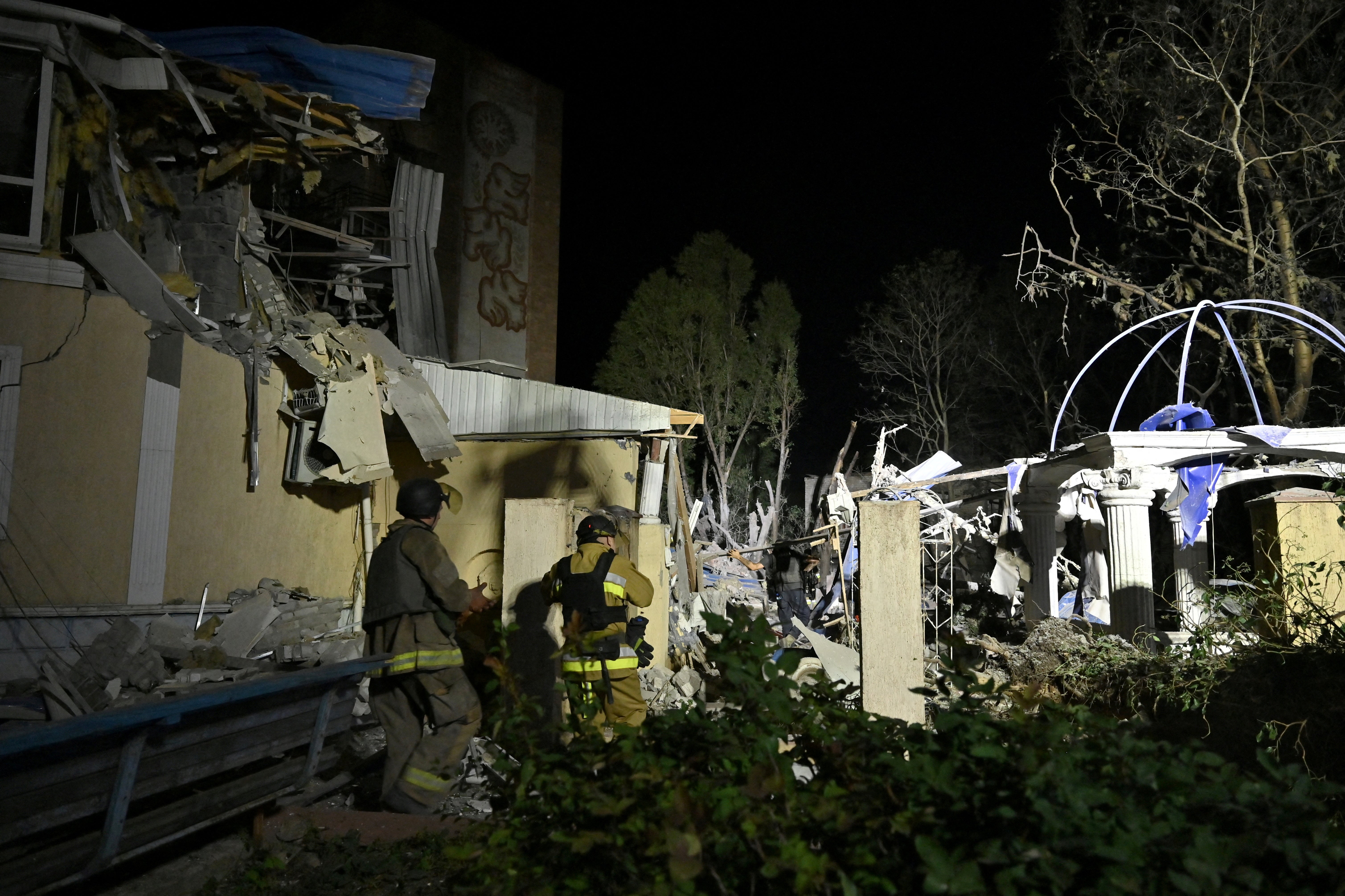 Ukrainian emergency services conduct a search and rescue operation among the rubble at the site where a hotel was hit by a missile in Kramatorsk, Donetsk region, after local authorities said Russia launched several attacks in the Ukrainian region, 24 August 2024