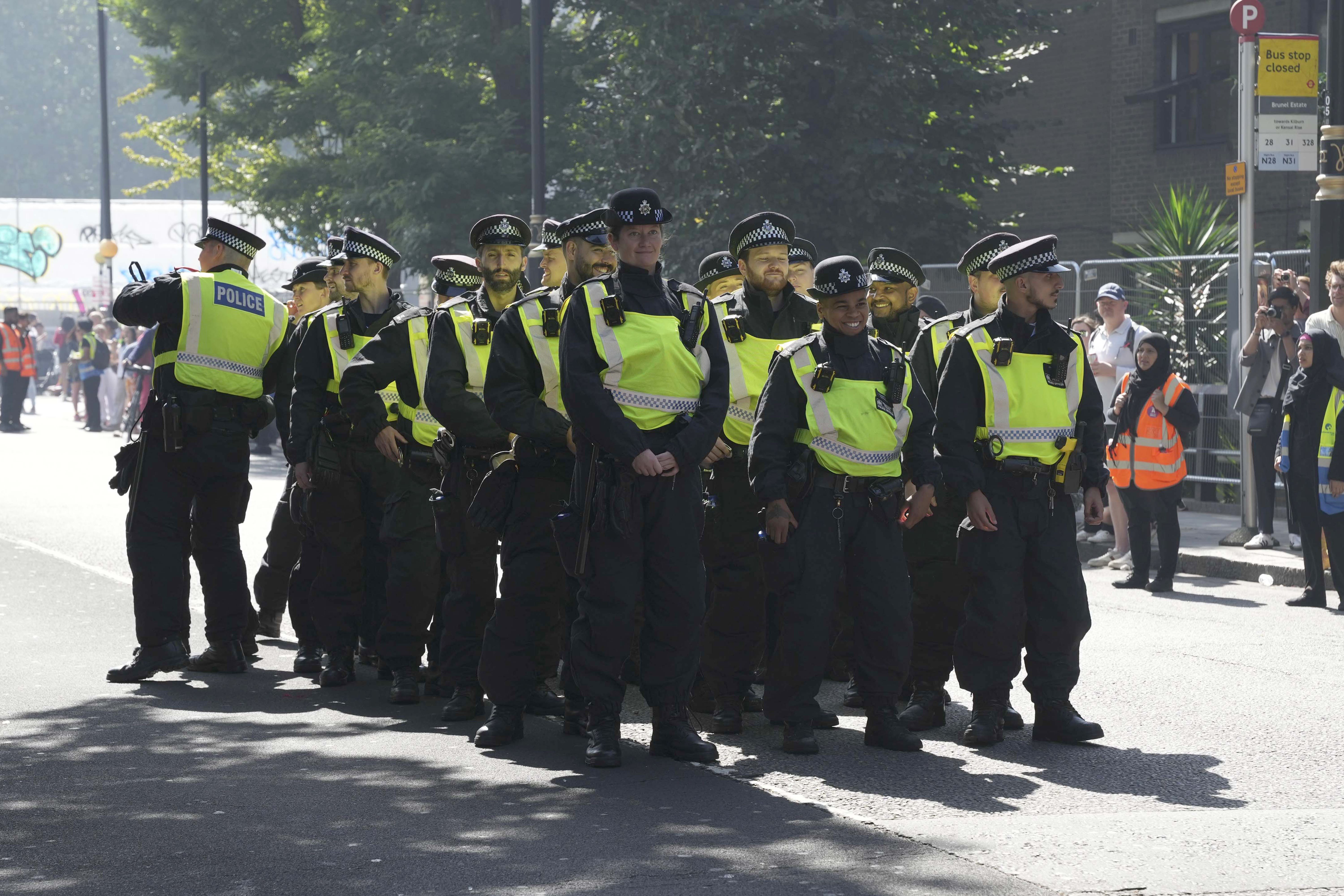 Police officers at the Children’s Day Parade, part of the Notting Hill Carnival celebration in west London (Jeff Moore/PA)