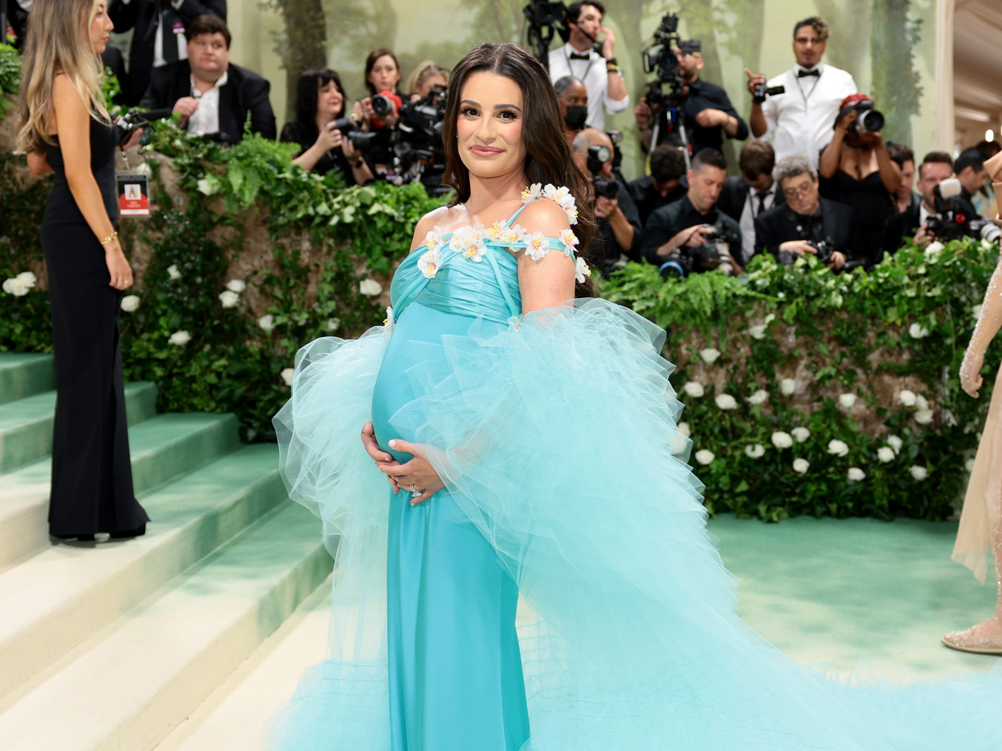 Lea Michele cradles her baby bump on the red carpet at the 2024 Met Gala