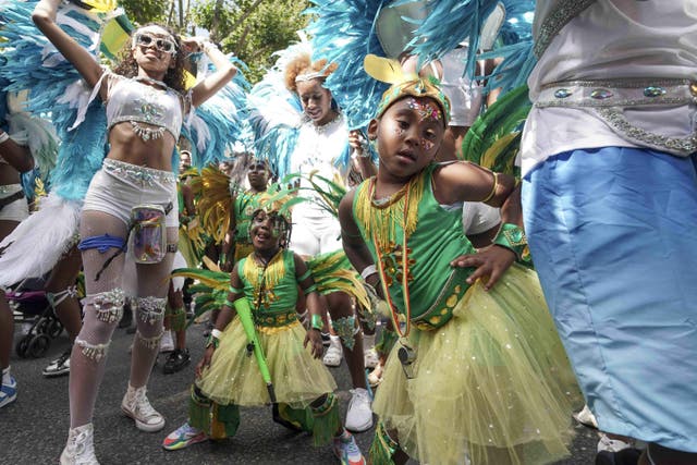 Two young dancers struck a pose during their parade (Jeff Moore/PA)